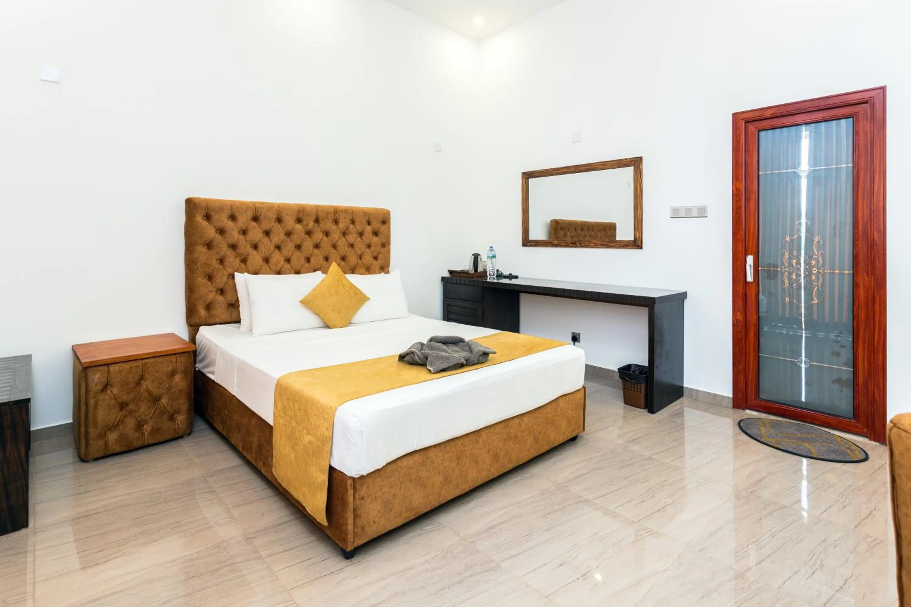 Bed in Polhena Grand Resort & Banquet