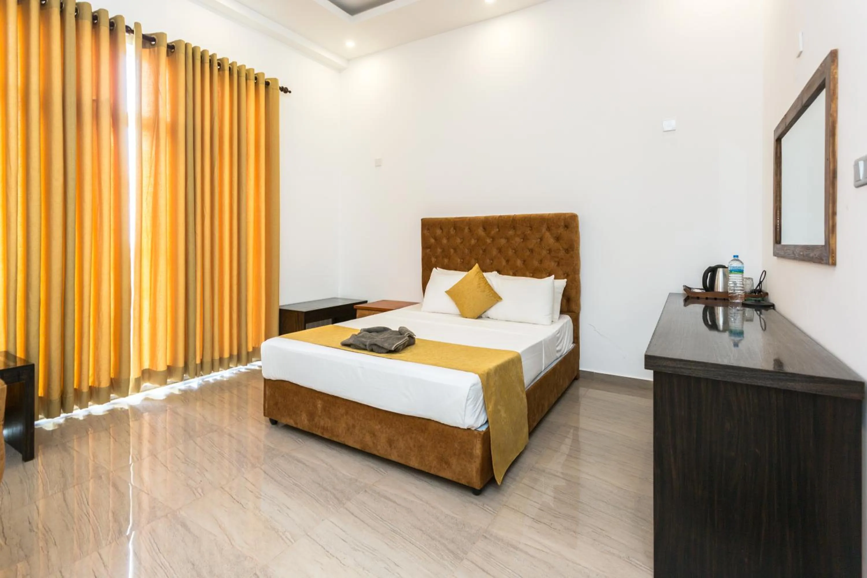 Bed in Polhena Grand Resort & Banquet