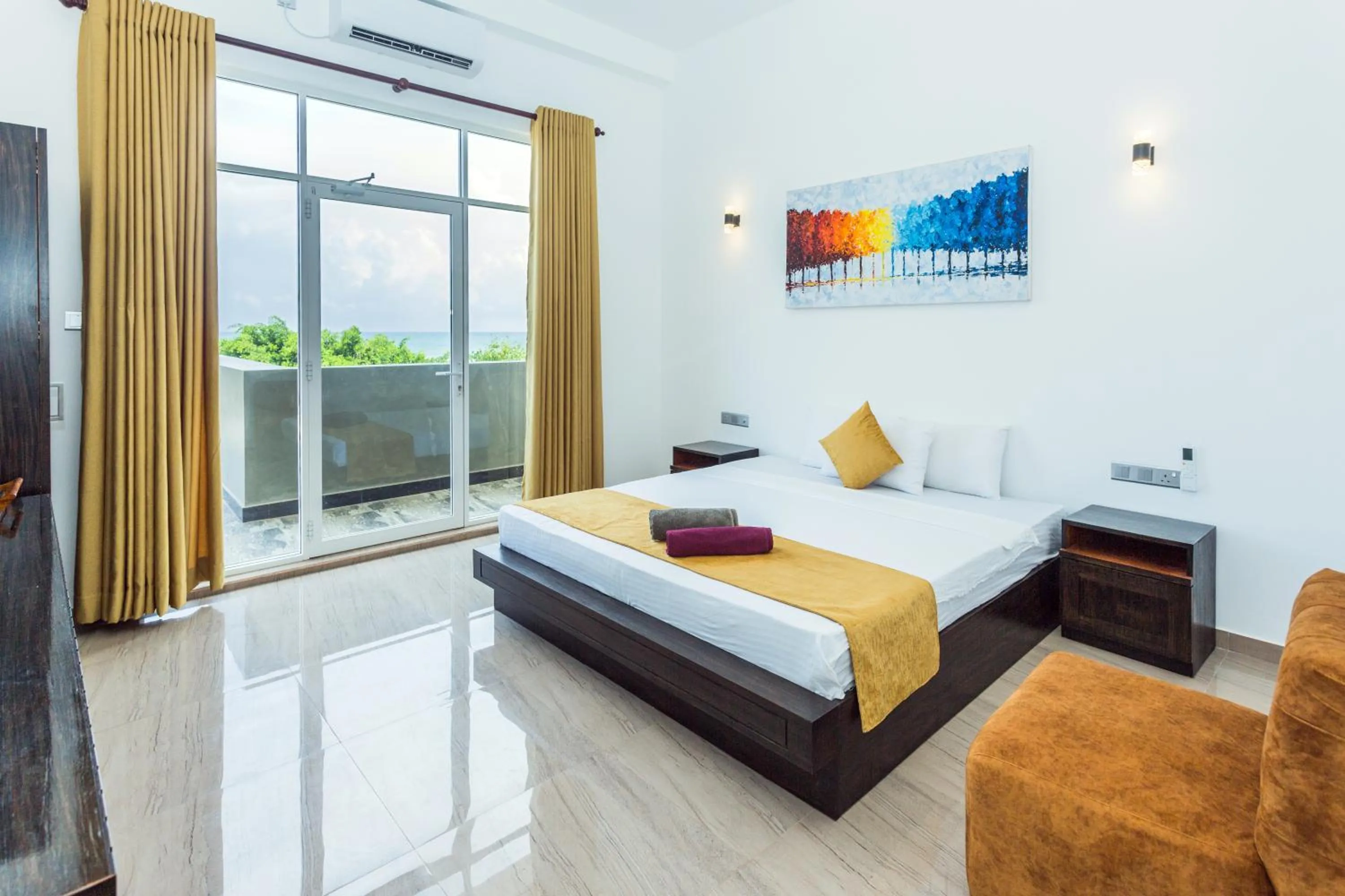 Bed in Polhena Grand Resort & Banquet