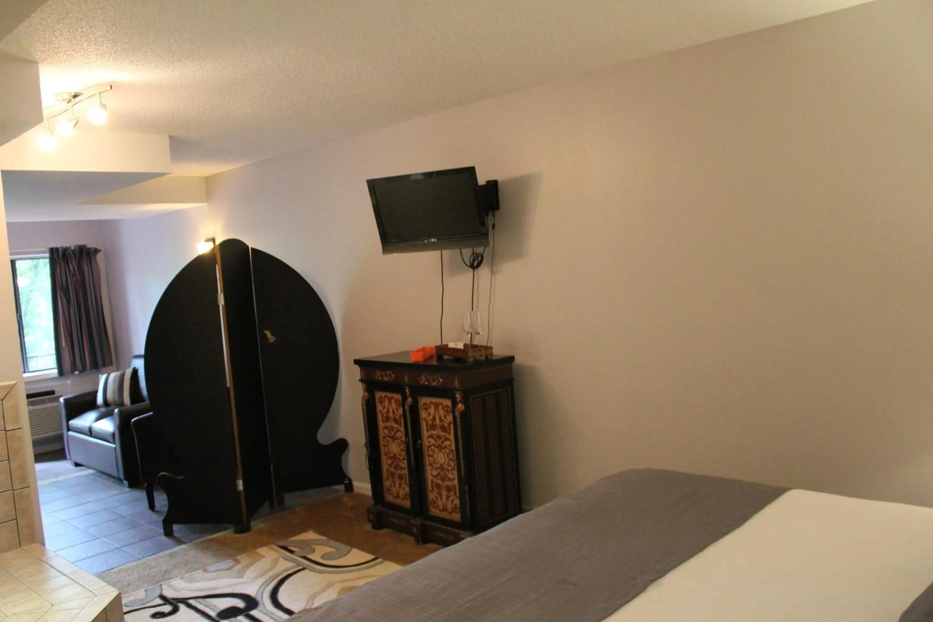 Bed in Brydan Suites