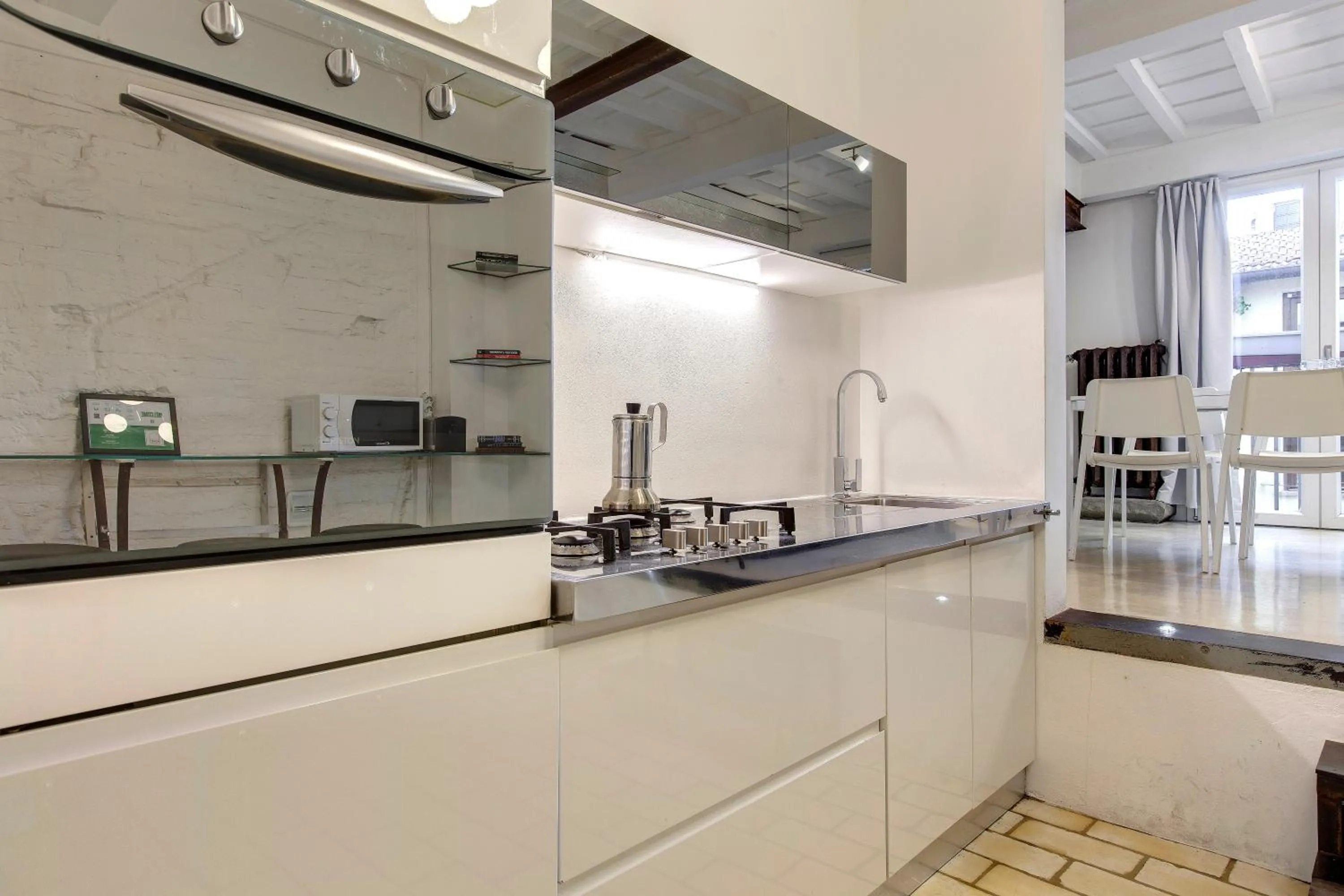 Kitchen or kitchenette in Victor Apartment by Mamo Florence