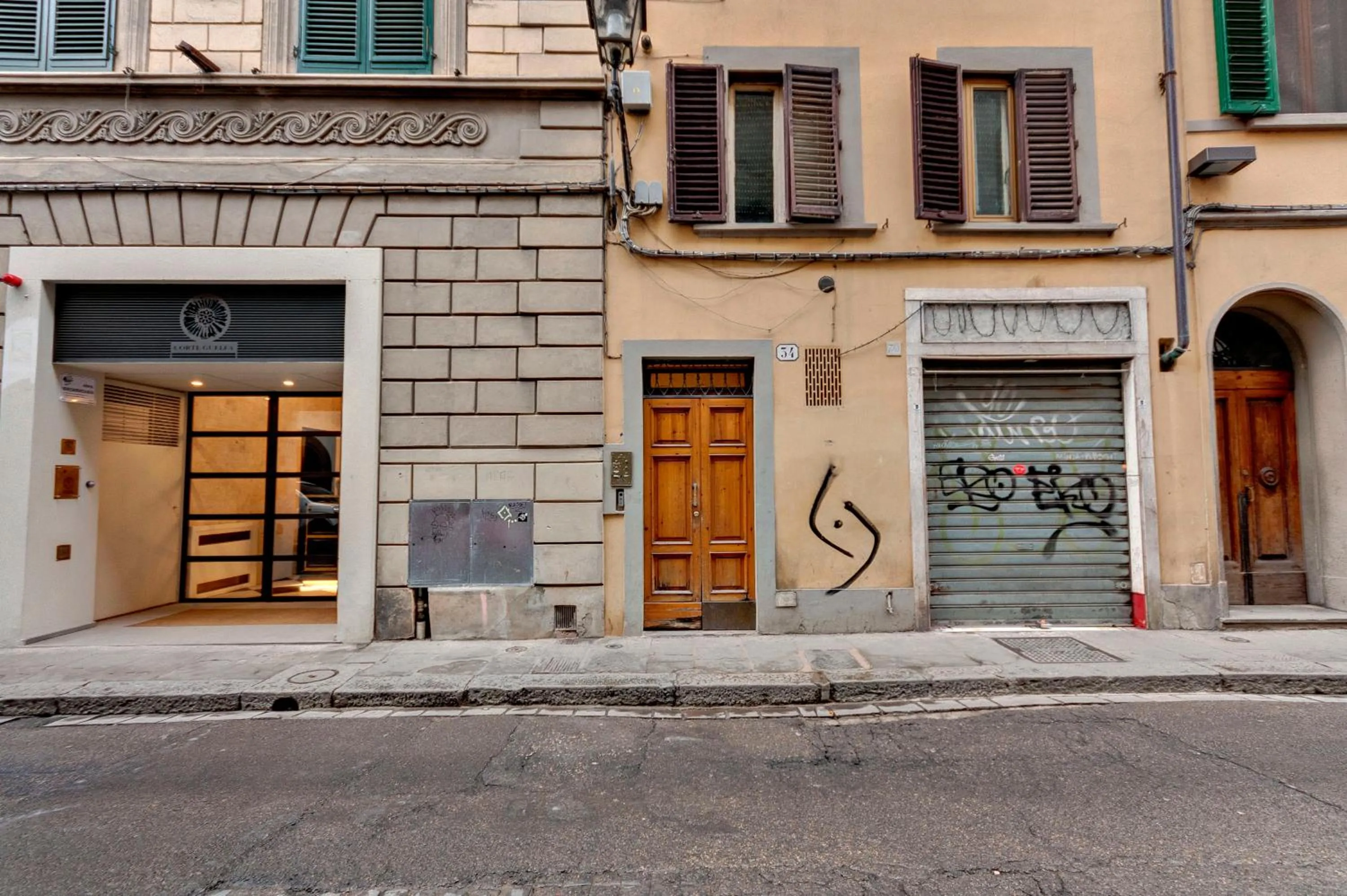 Facade/entrance in Victor Apartment by Mamo Florence