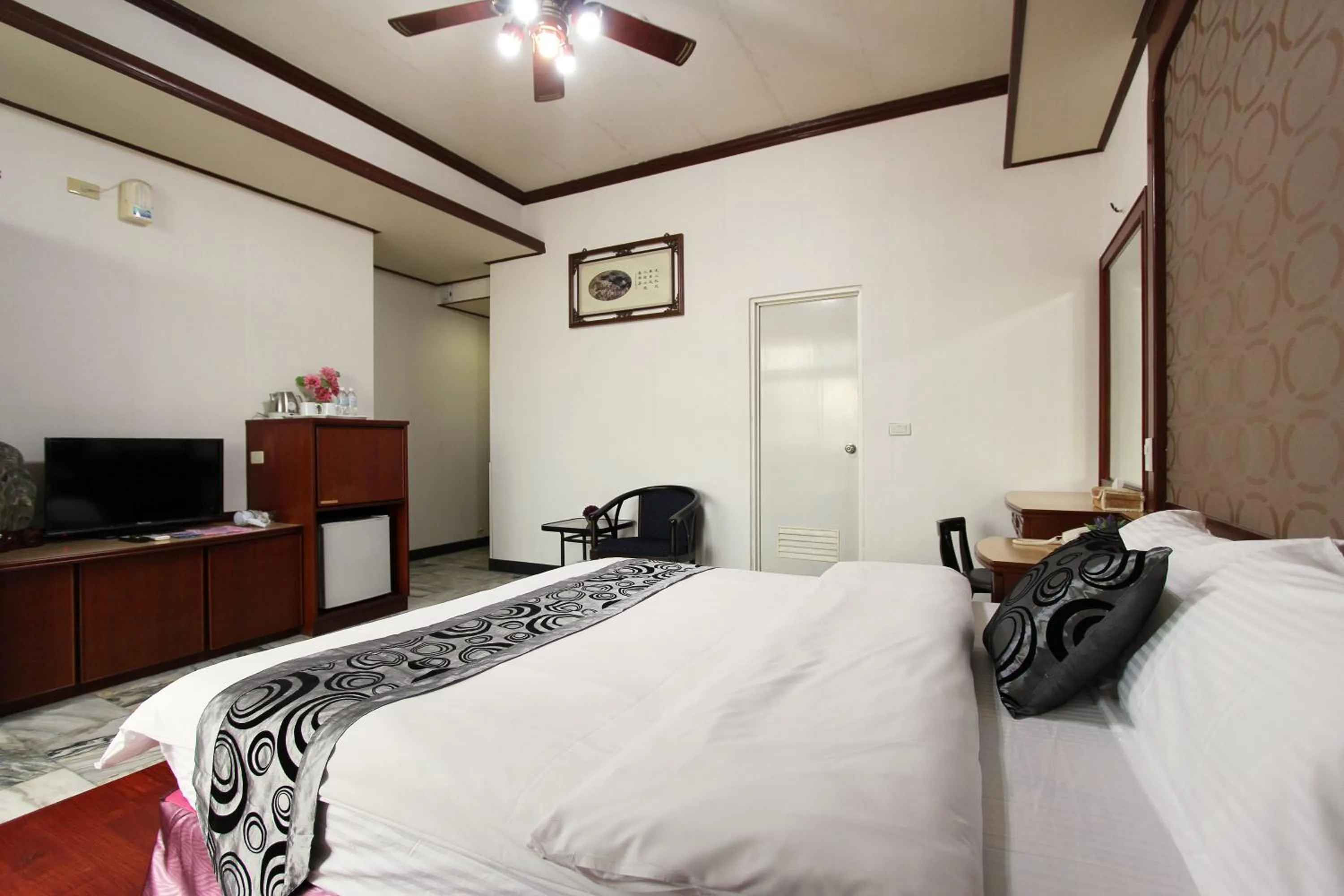 Bed in 陶陶居商旅 Tautauchu Hotel