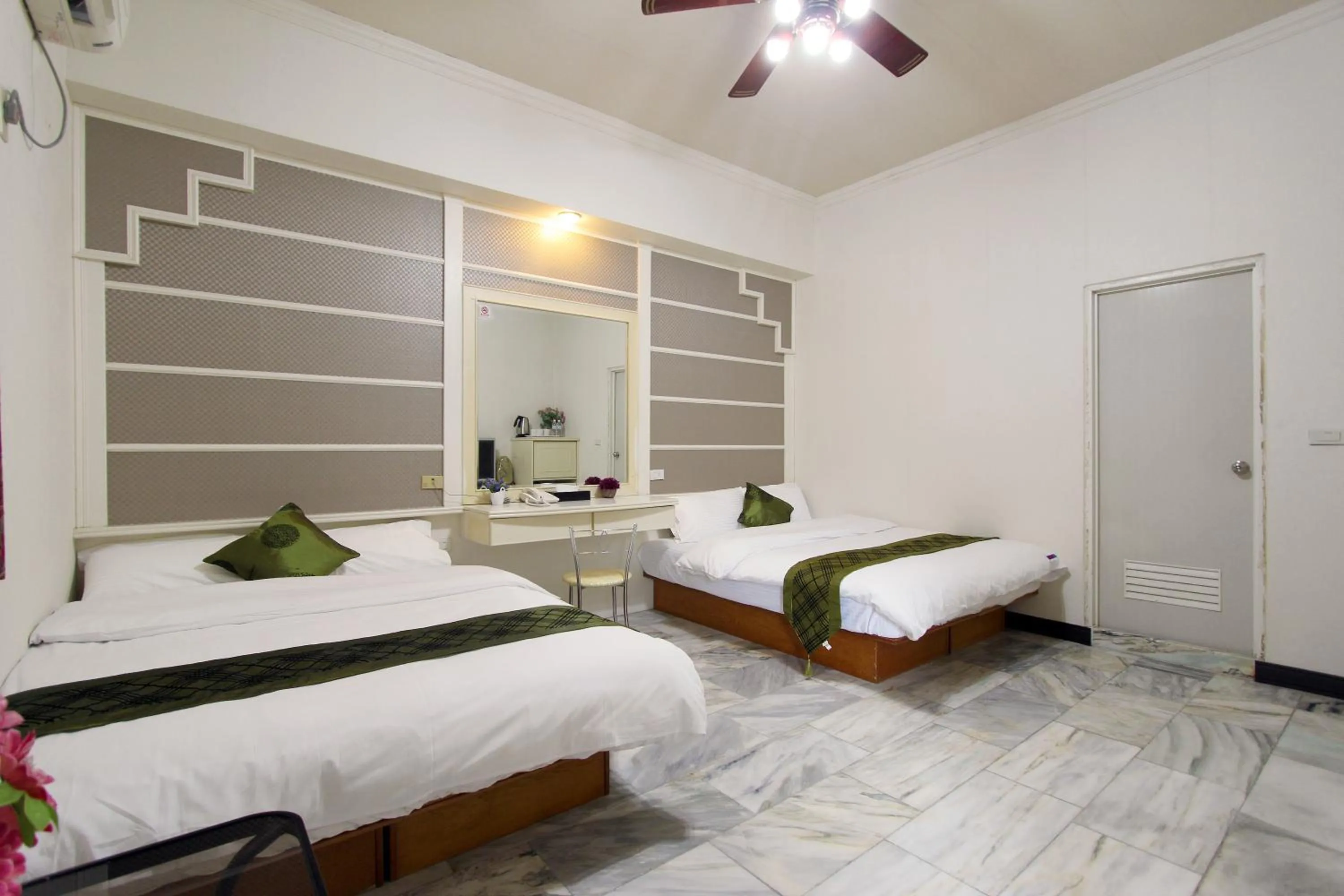 Bed in 陶陶居商旅 Tautauchu Hotel