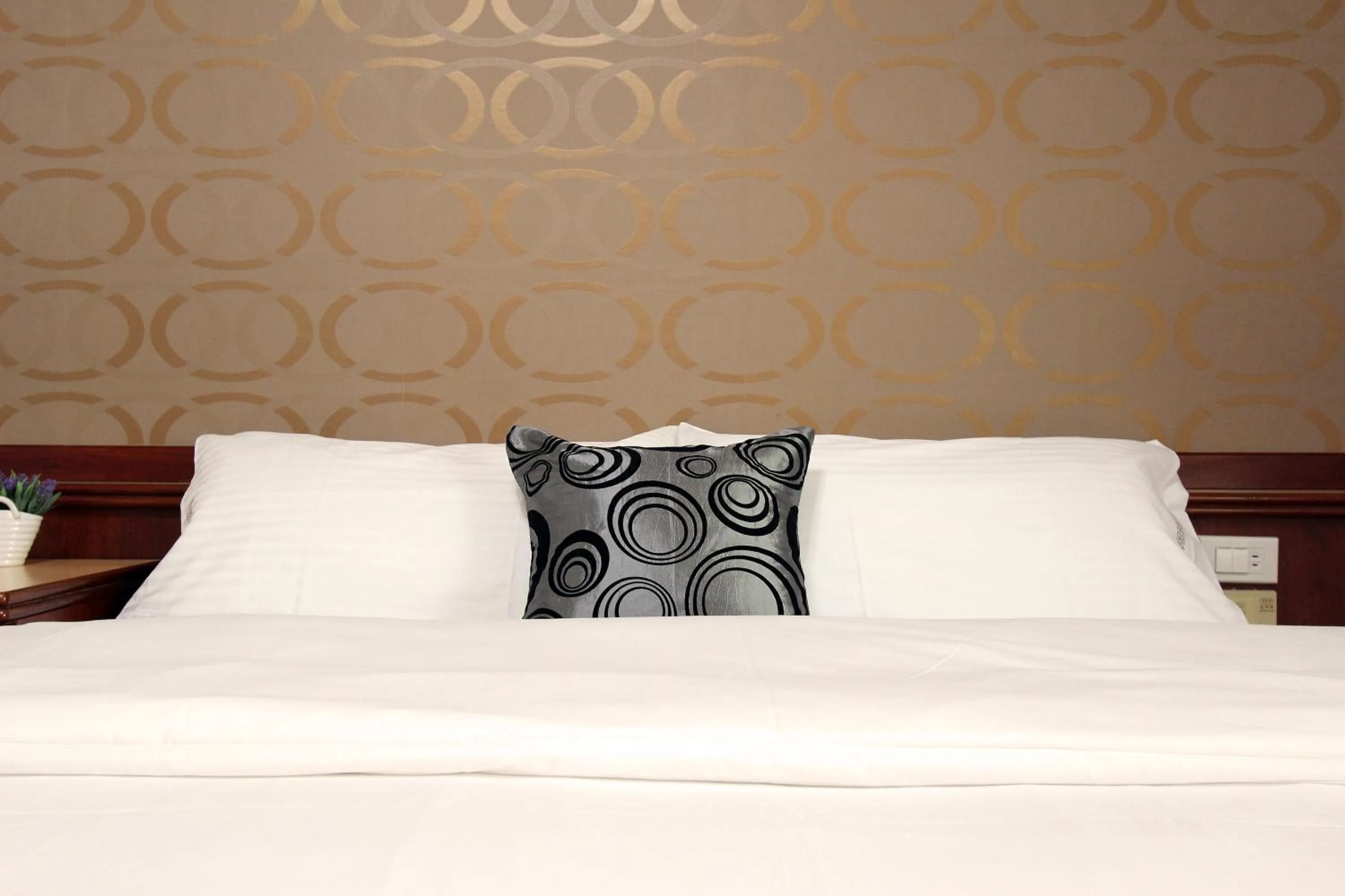 Bed in 陶陶居商旅 Tautauchu Hotel