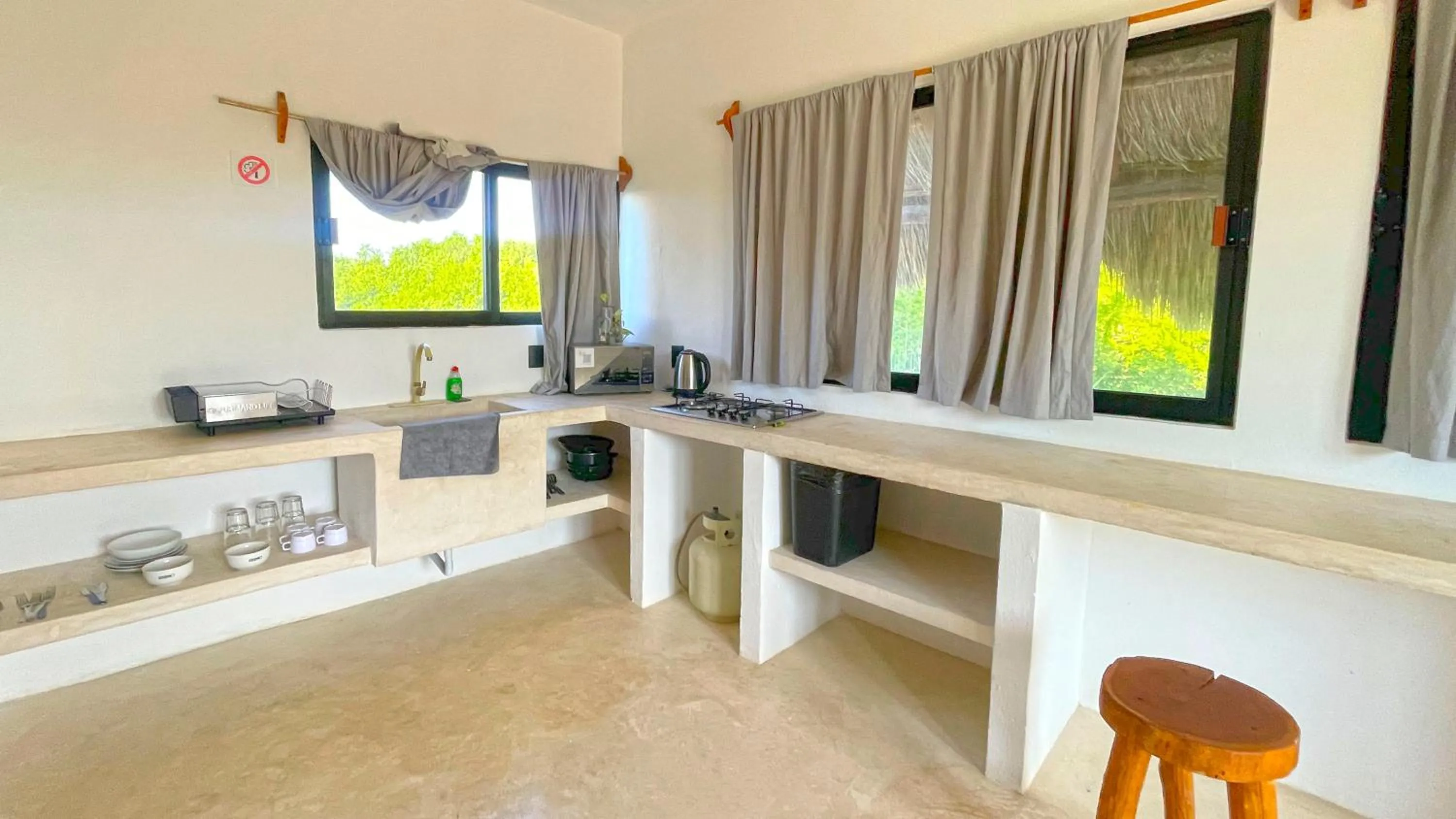 kitchen in Casa Tekio Holbox By Kin Studios