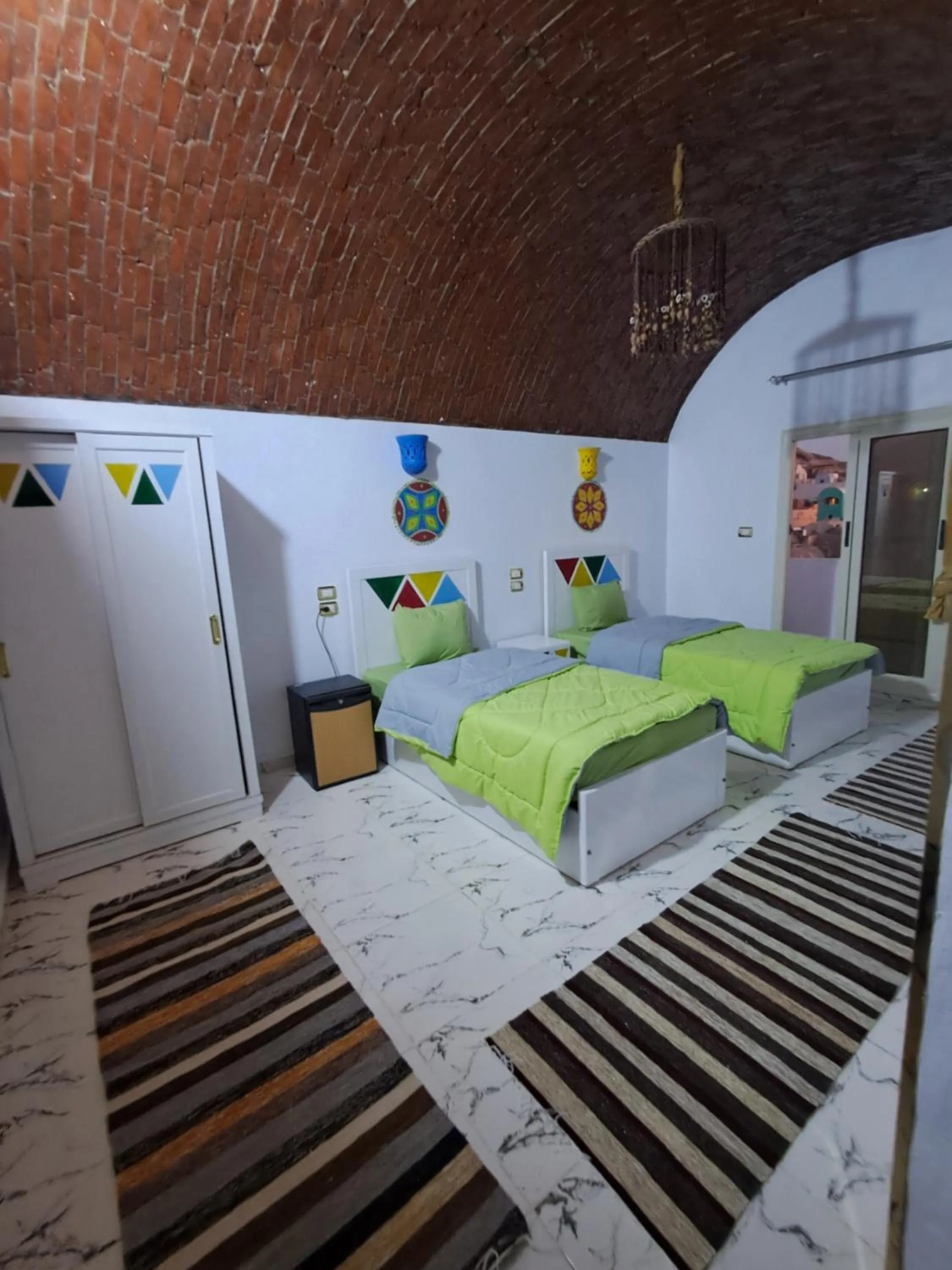 Bed in Lawanda Nubian B&B