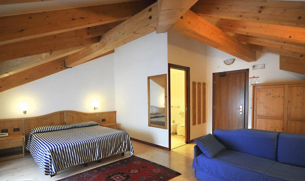 Bed in Hotel Dolomiti