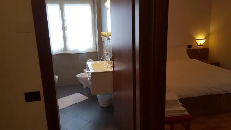 Bed in Hotel Dolomiti