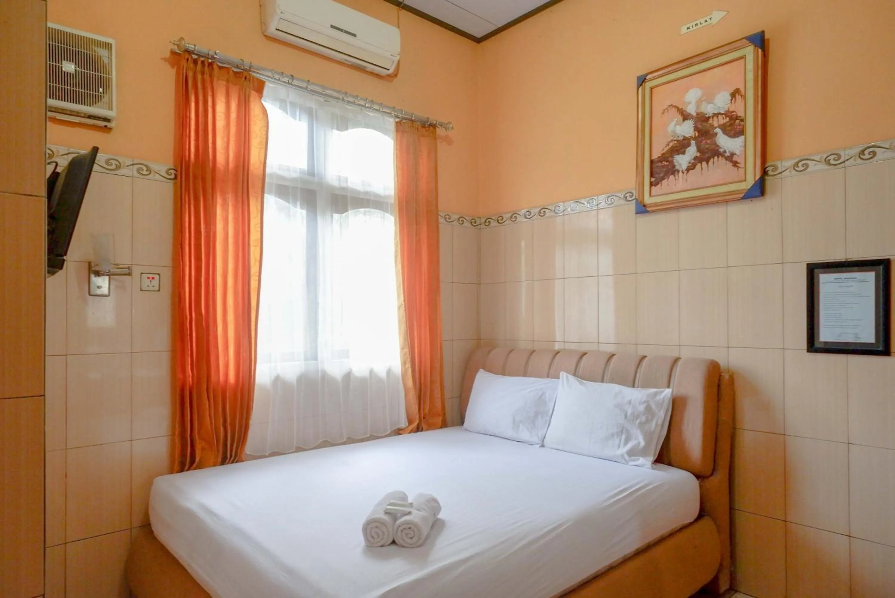 Bed in Urbanview Hotel Anugrah Kendal by RedDoorz