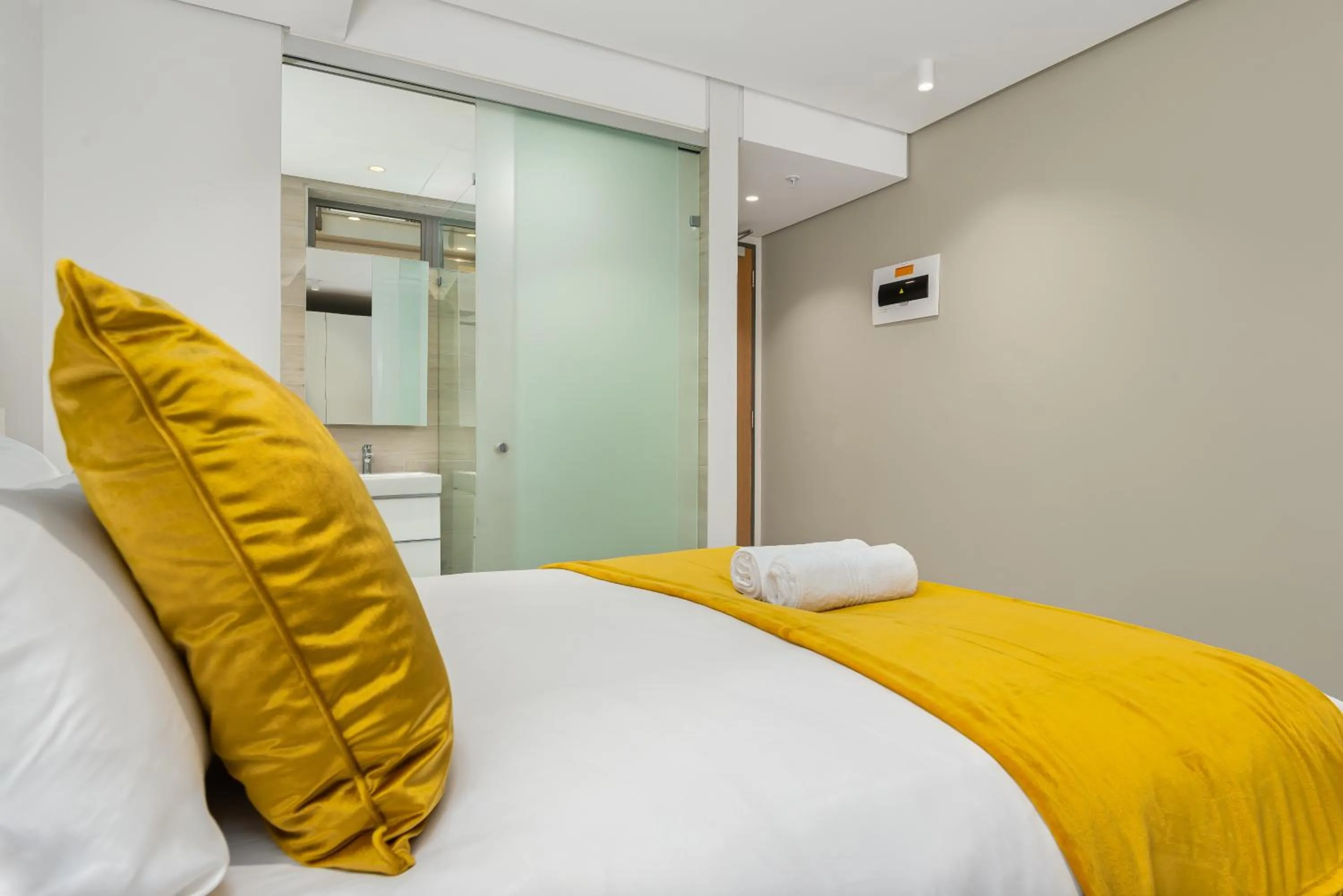 Bed in 117 on Strand Luxury Apartments