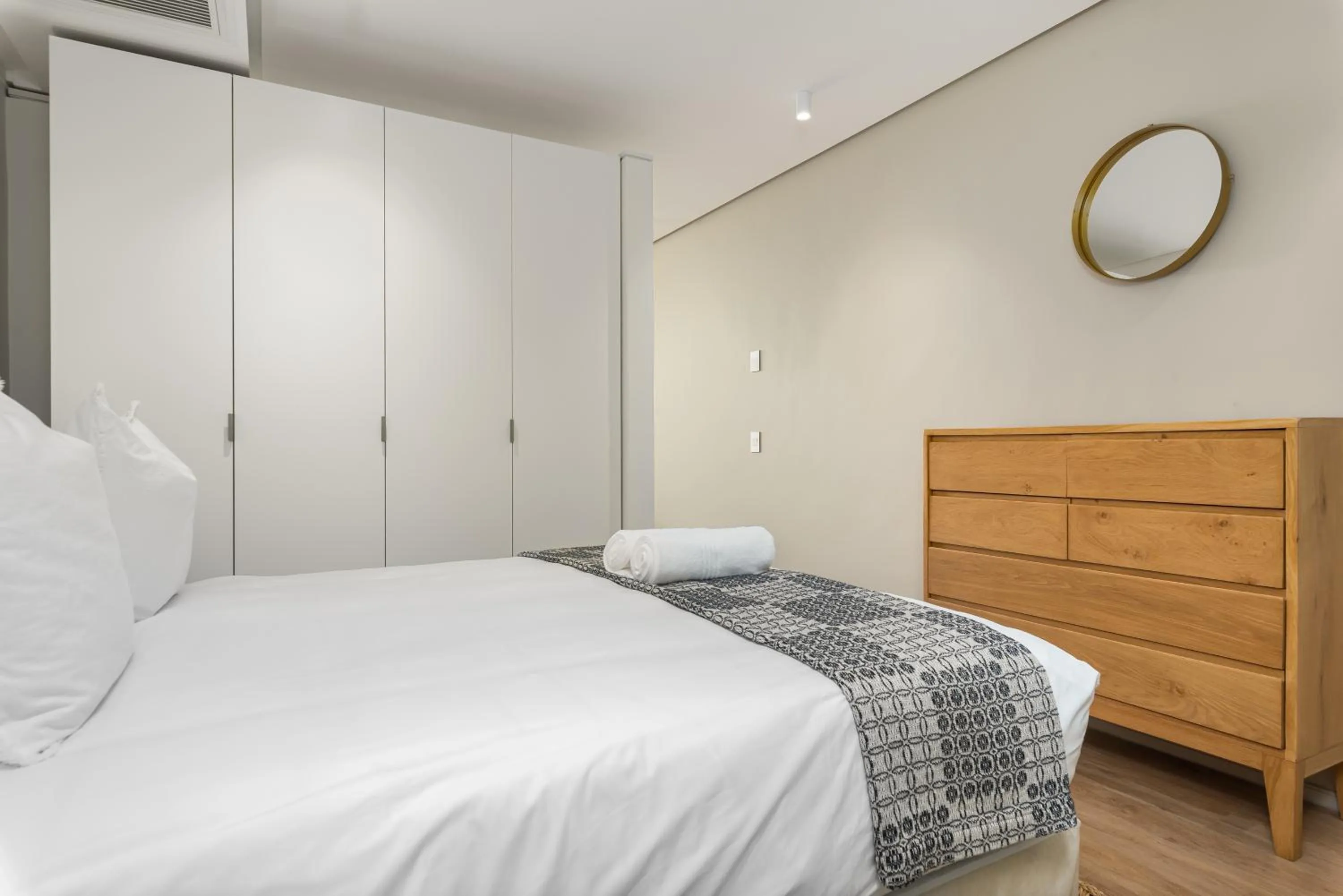 Bed in 117 on Strand Luxury Apartments