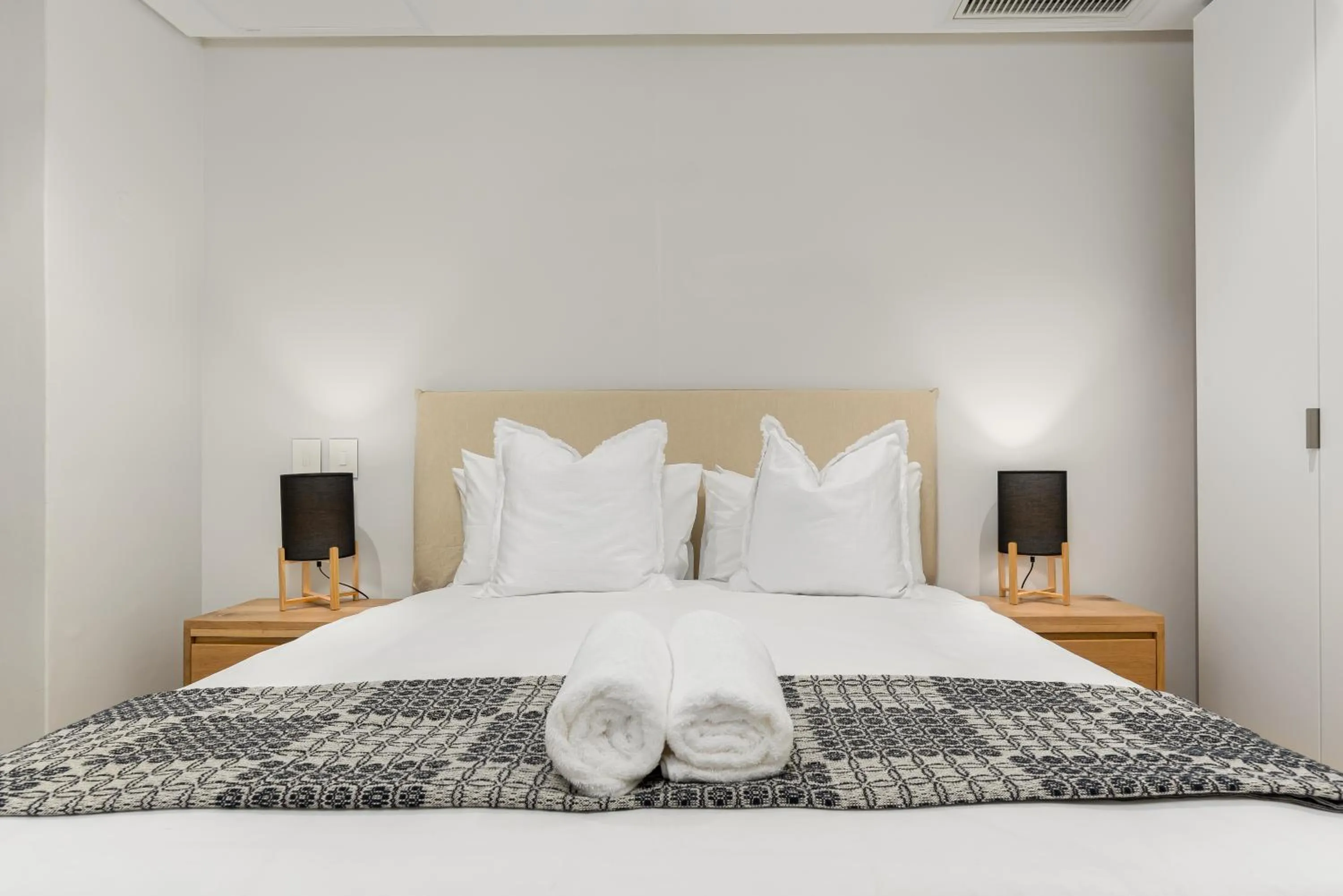 Bed in 117 on Strand Luxury Apartments