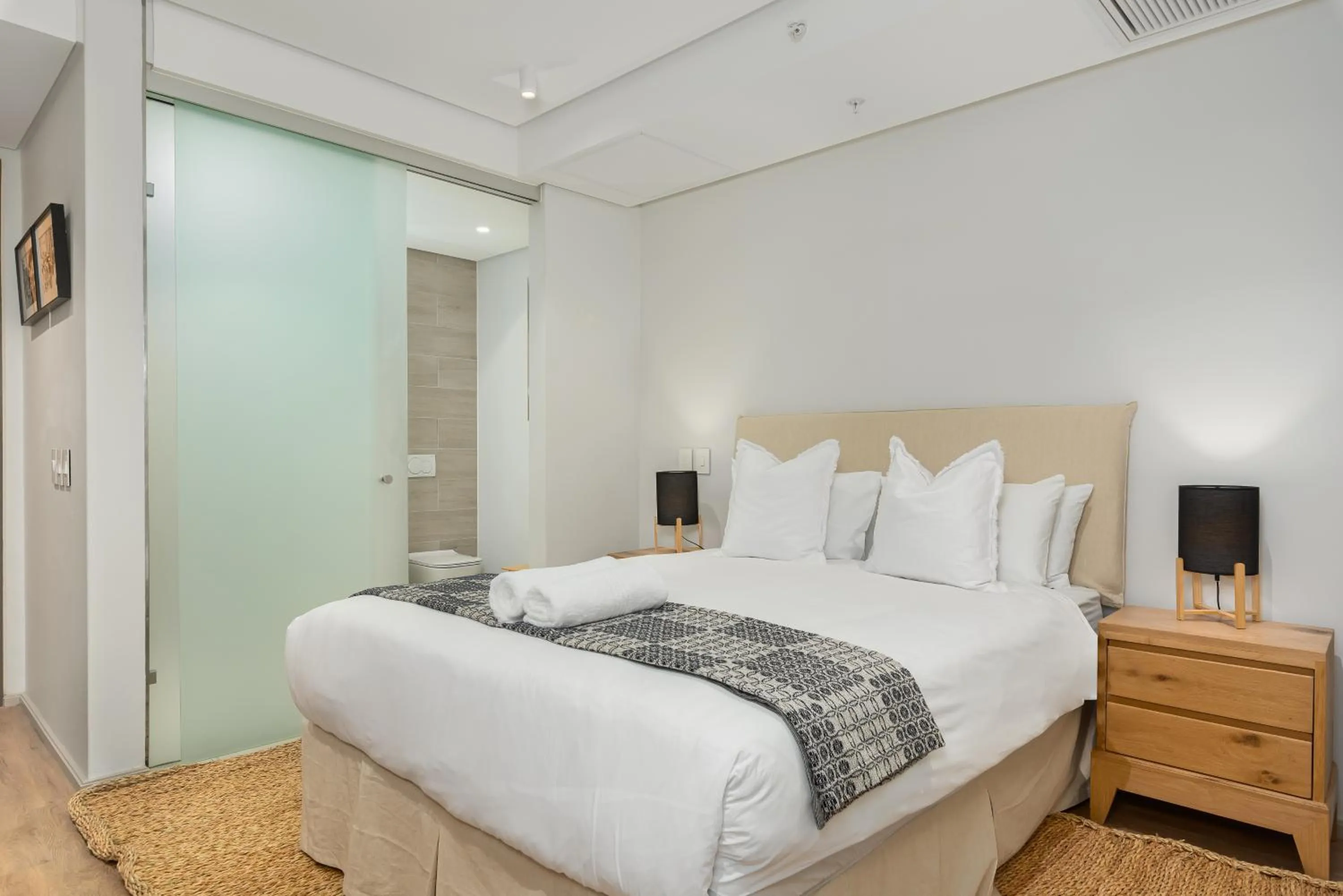 Bed in 117 on Strand Luxury Apartments