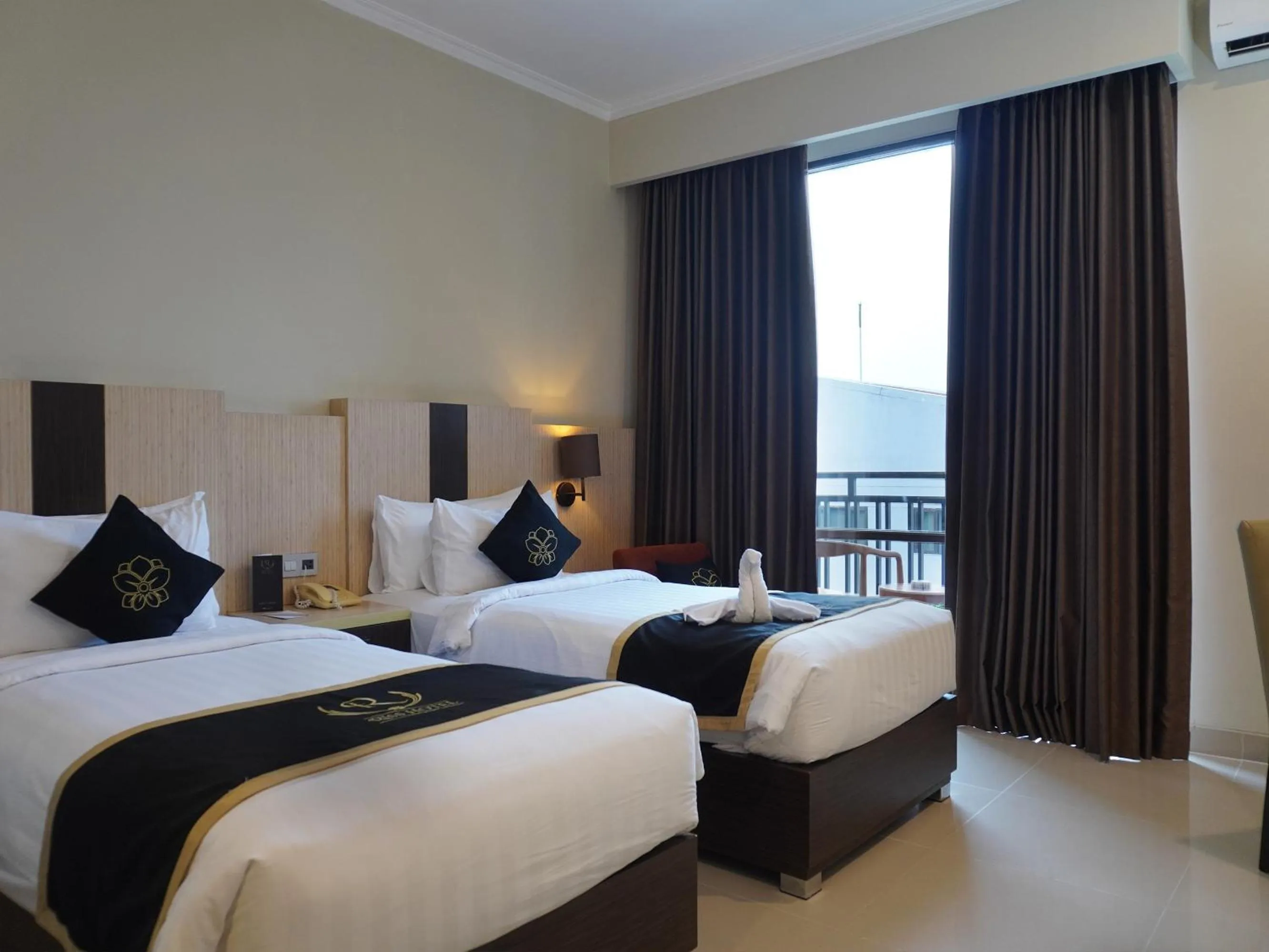 Bed in Riss Hotel Malioboro