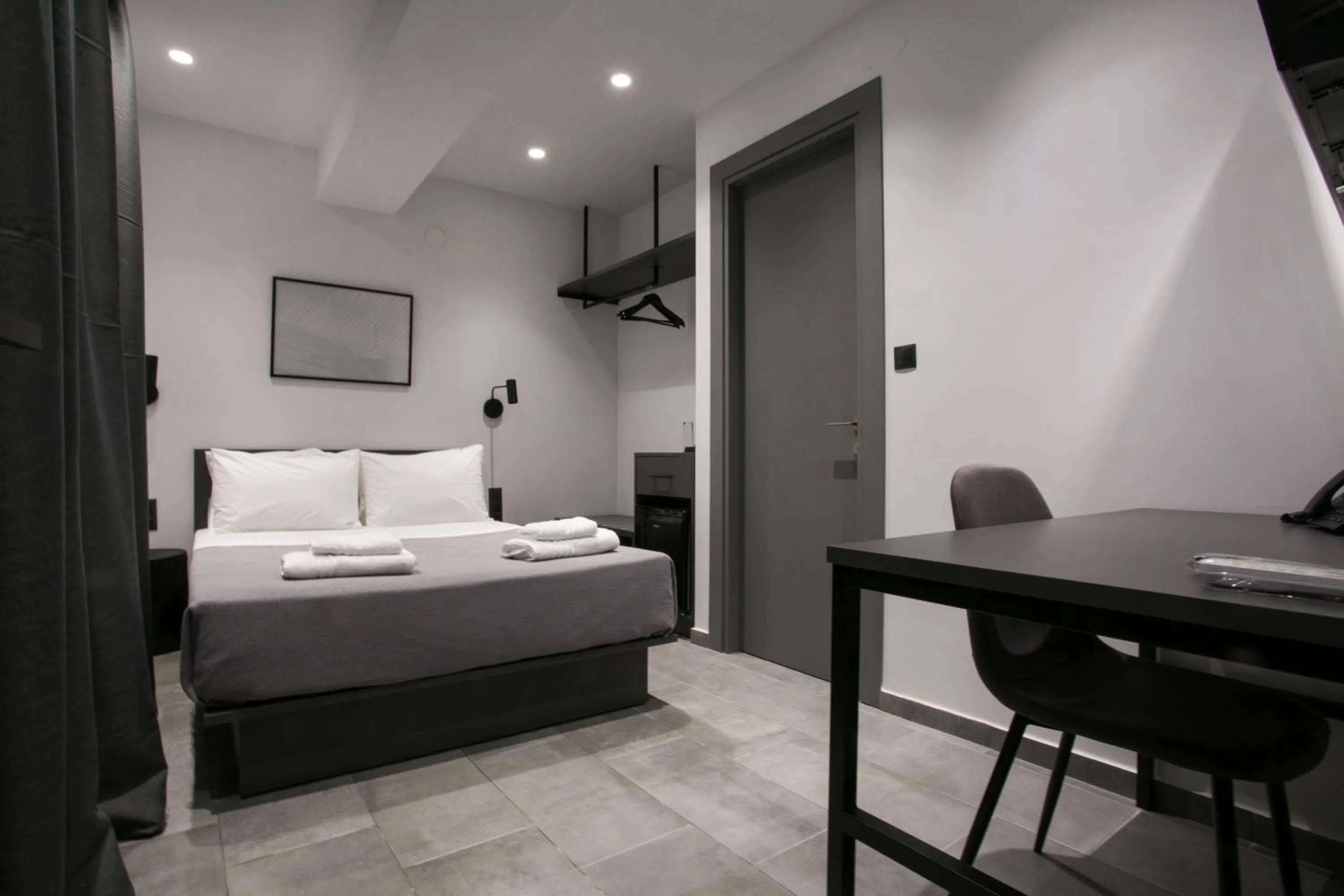 Photo of the whole room, Bed in White Trilogy