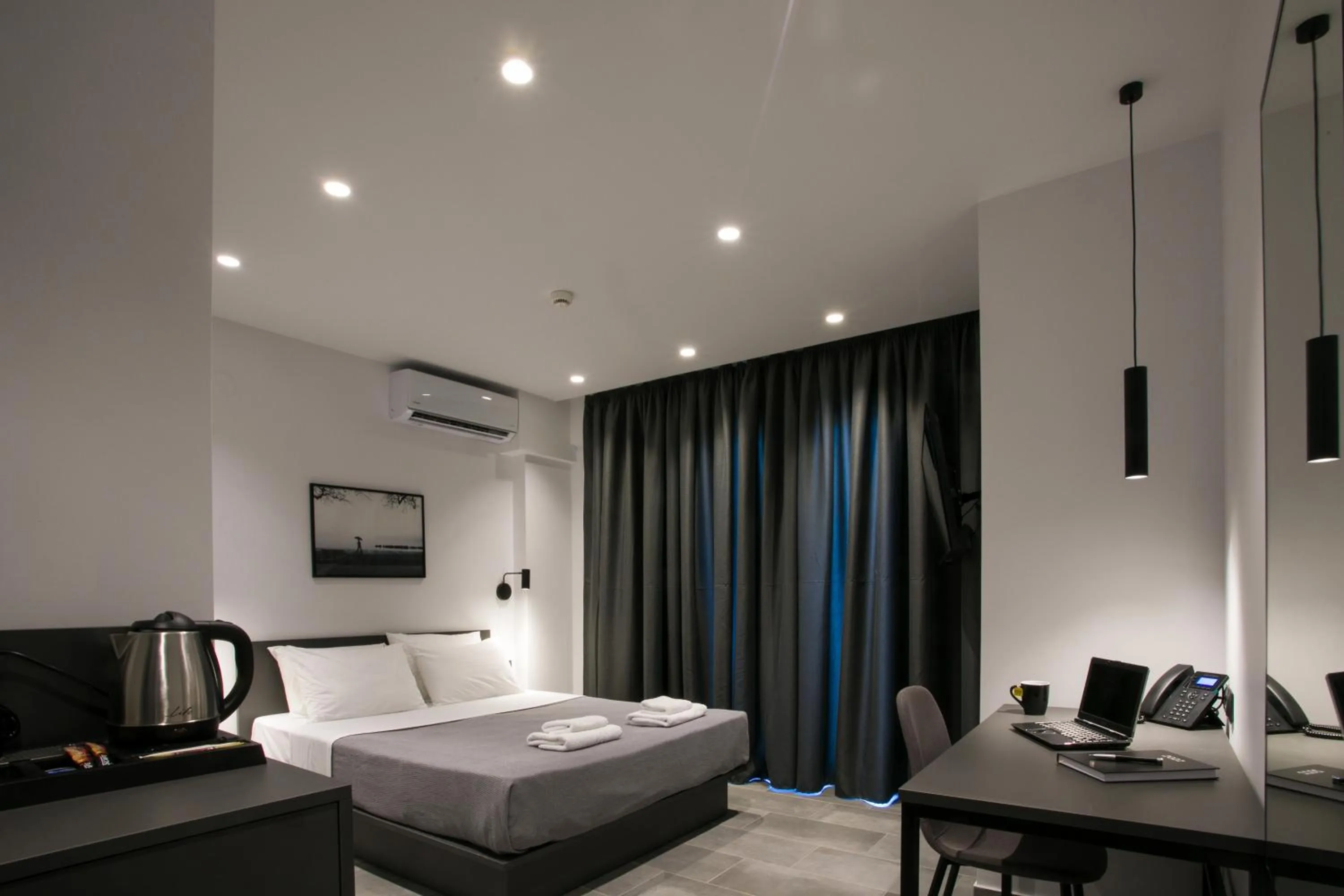 Photo of the whole room, Bed in White Trilogy