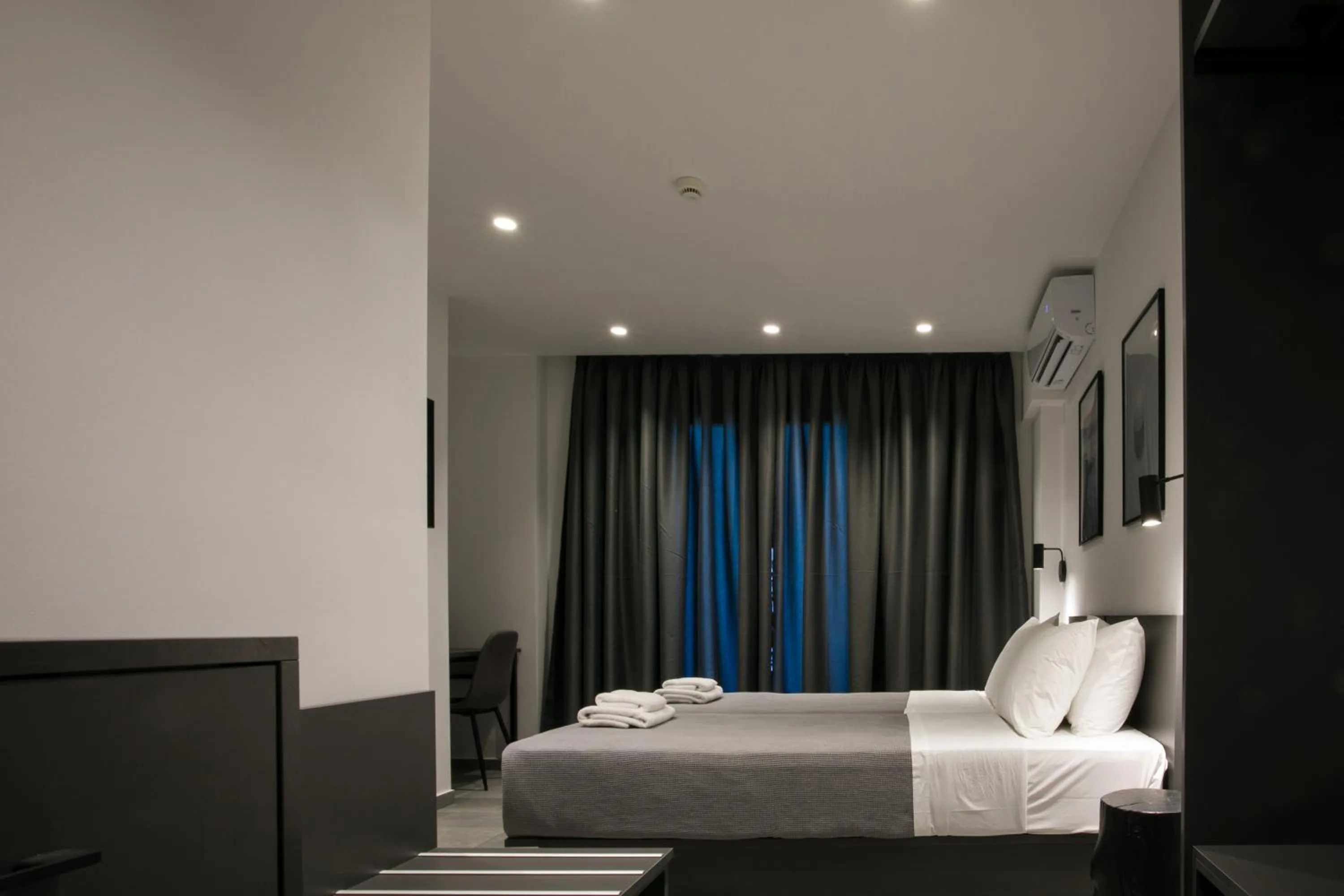 Photo of the whole room, Bed in White Trilogy