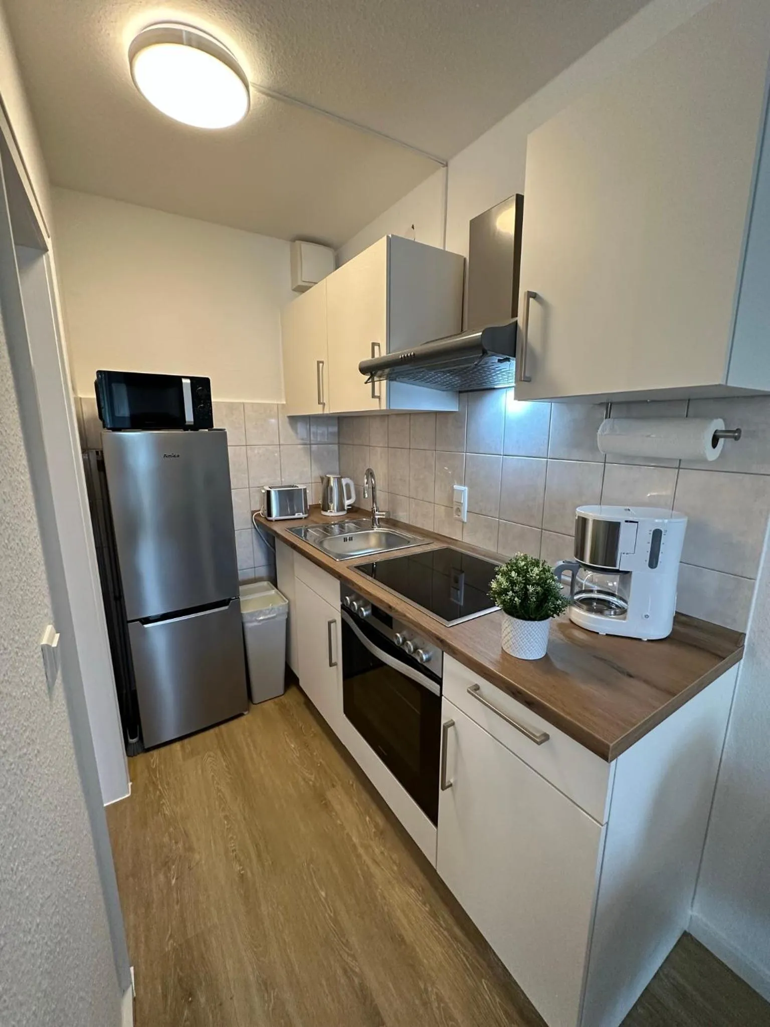 Kitchen or kitchenette in Nanis Hotel & Appartements