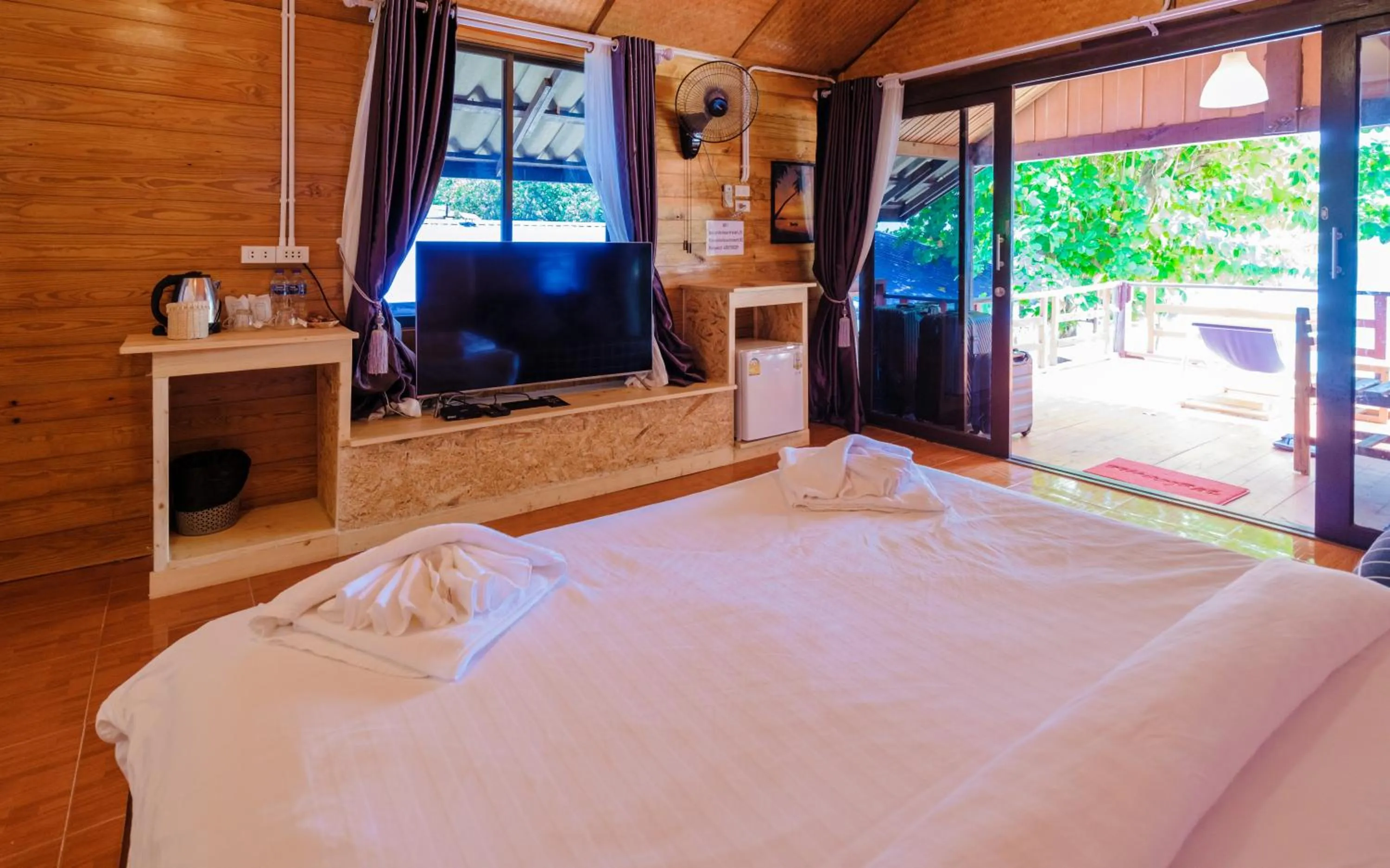 Bed in Lipe Garden Beach Resort