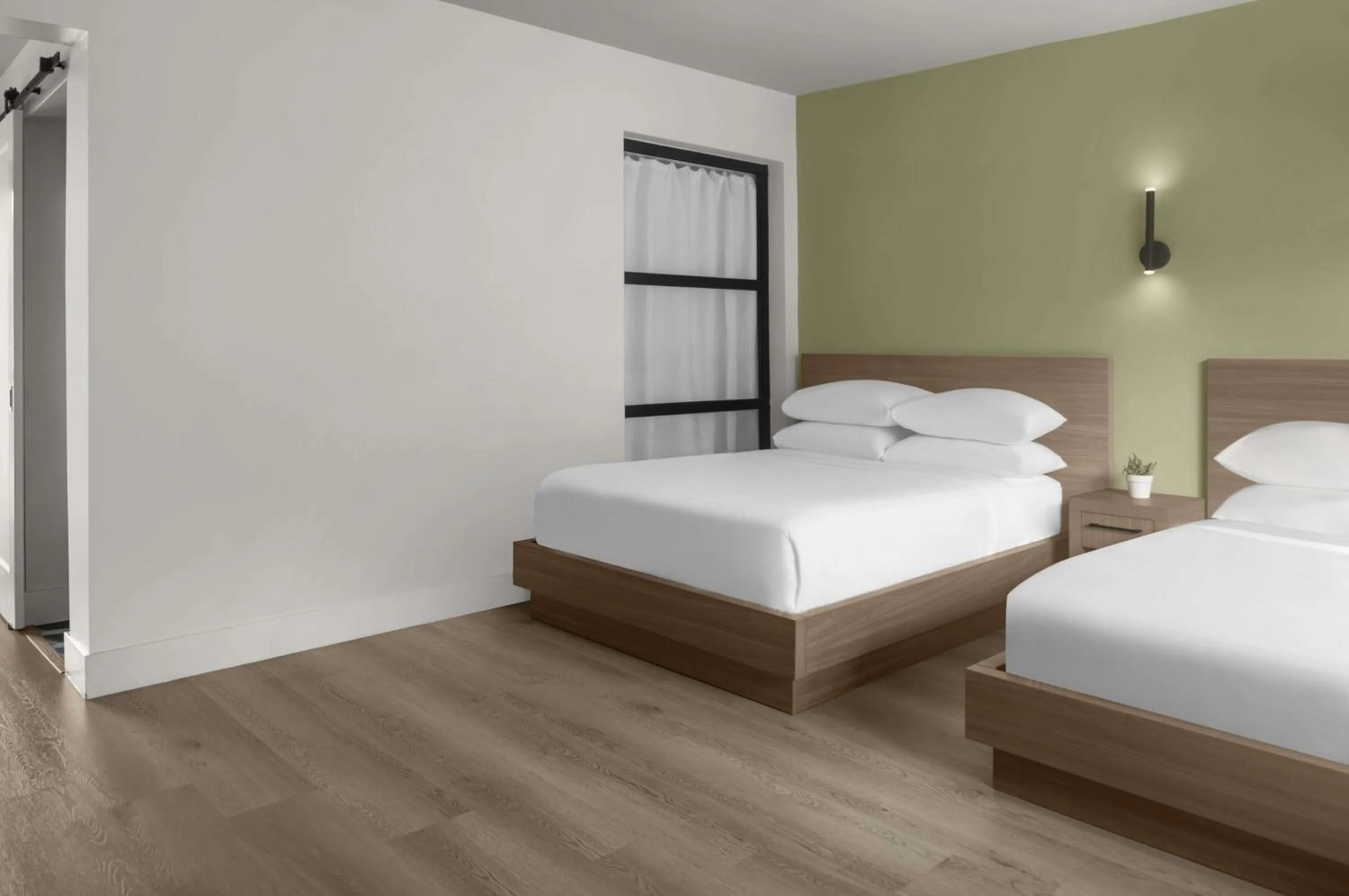 Bed in The Lum Hotel Los Angeles Stadium District