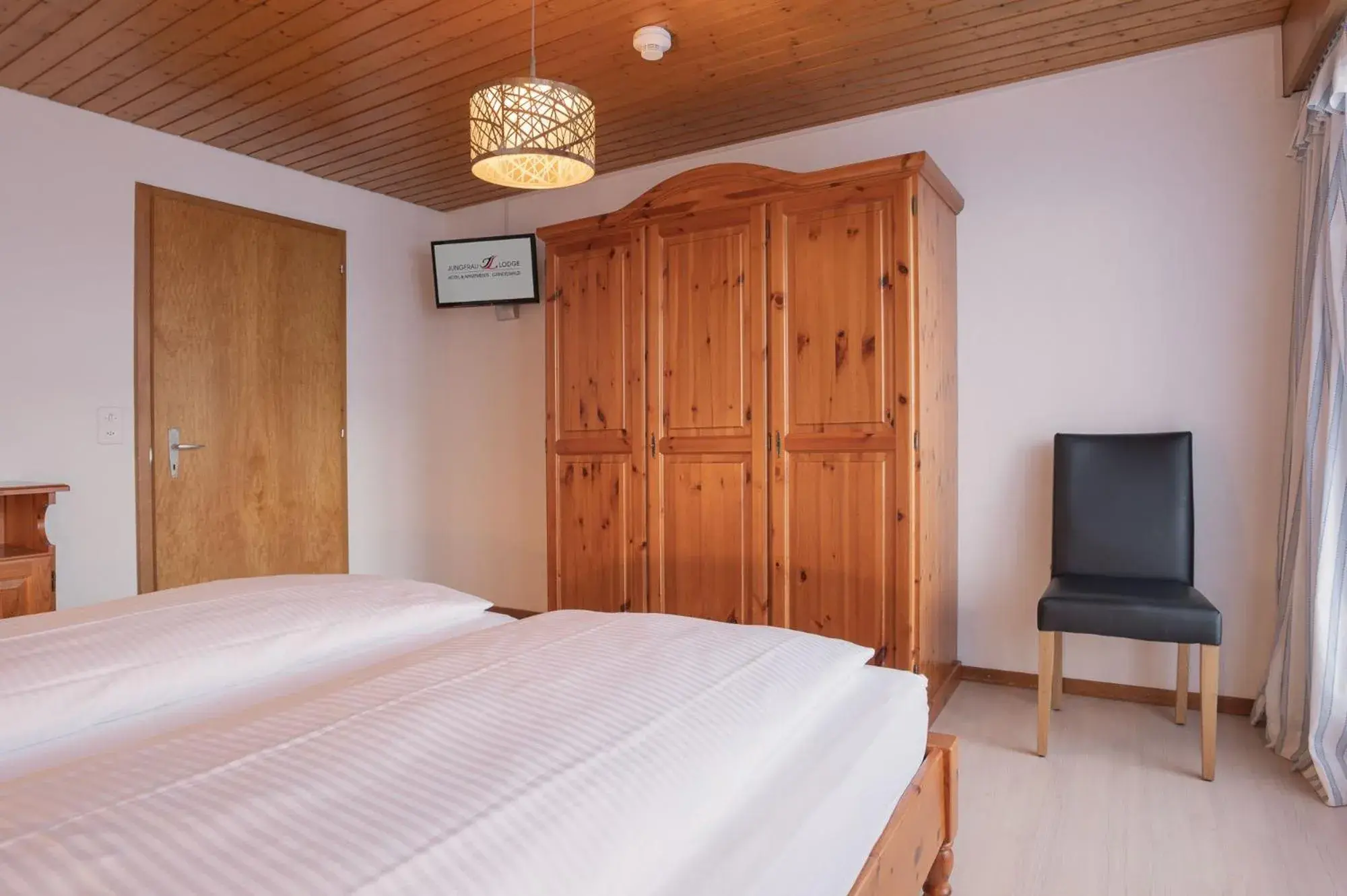 Bedroom, Bed in Apartment Jungfrau Lodge Bedroom, Bed in Apartment Jungfrau Lodge