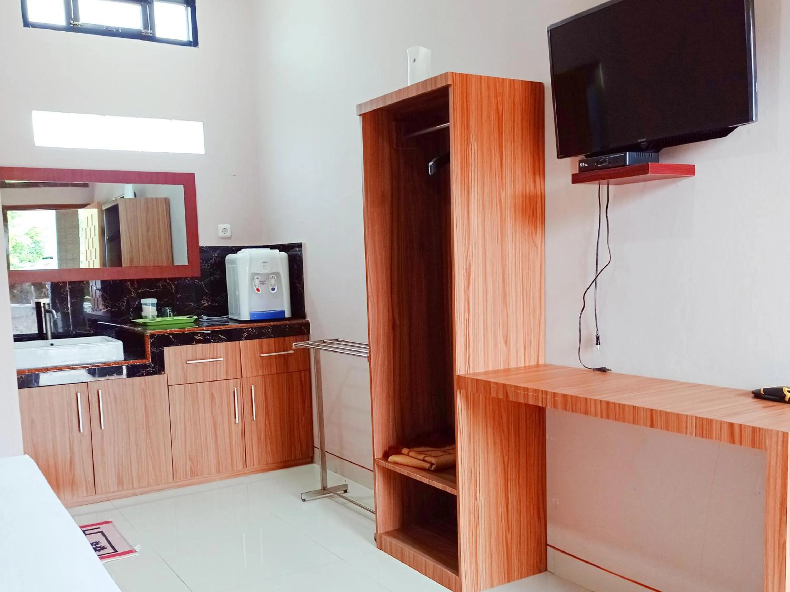 TV and multimedia in RedDoorz Syariah Near Danau Tes Bengkulu