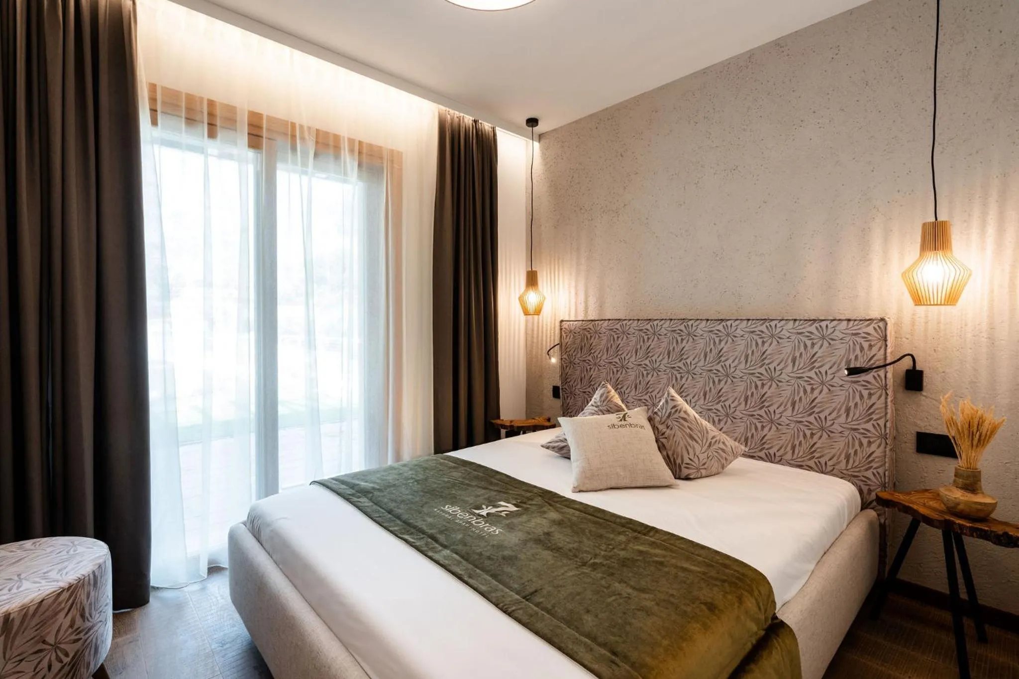 Bed in Sibenbras Natural Aparthotel