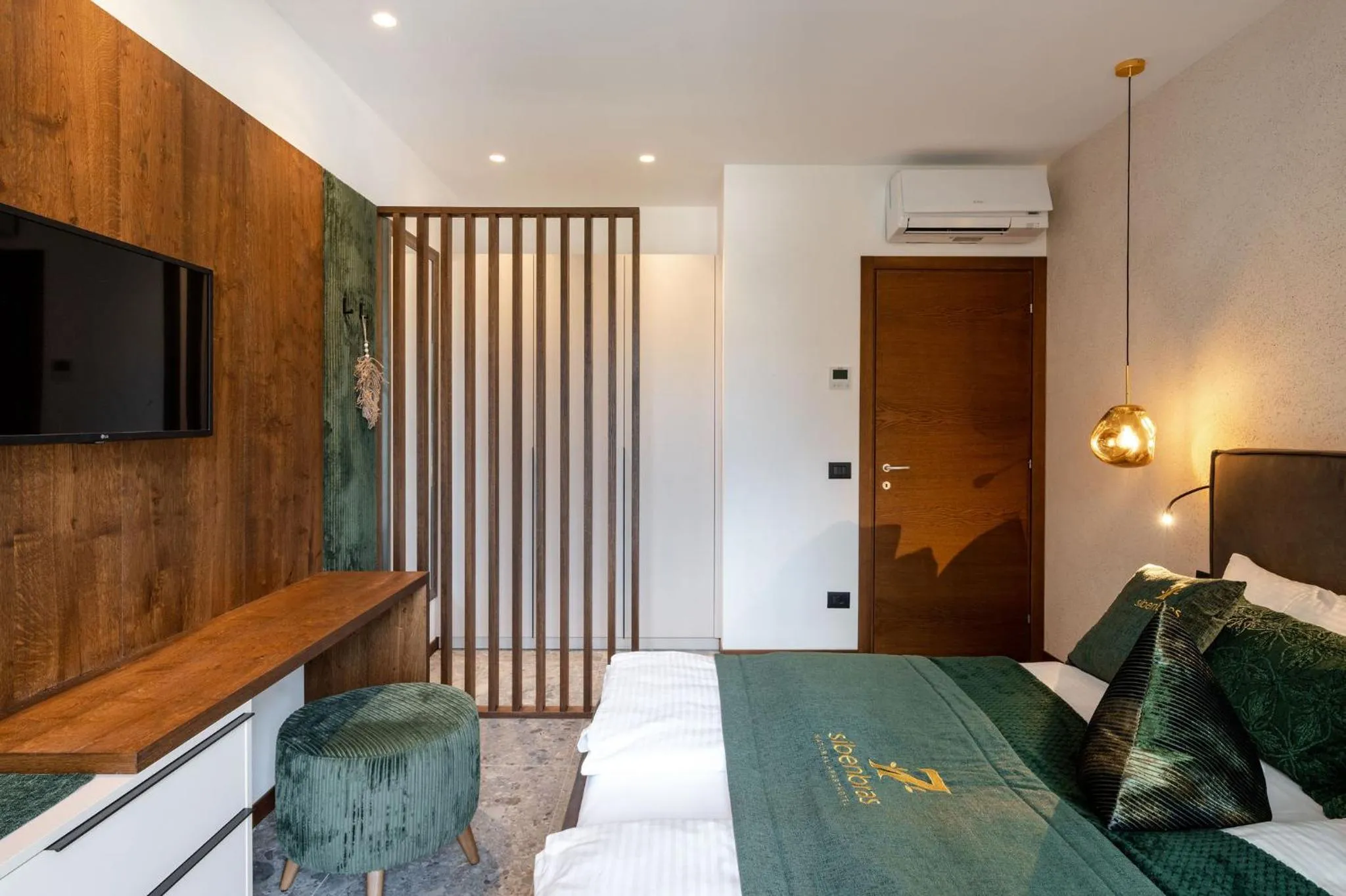 Bed in Sibenbras Natural Aparthotel