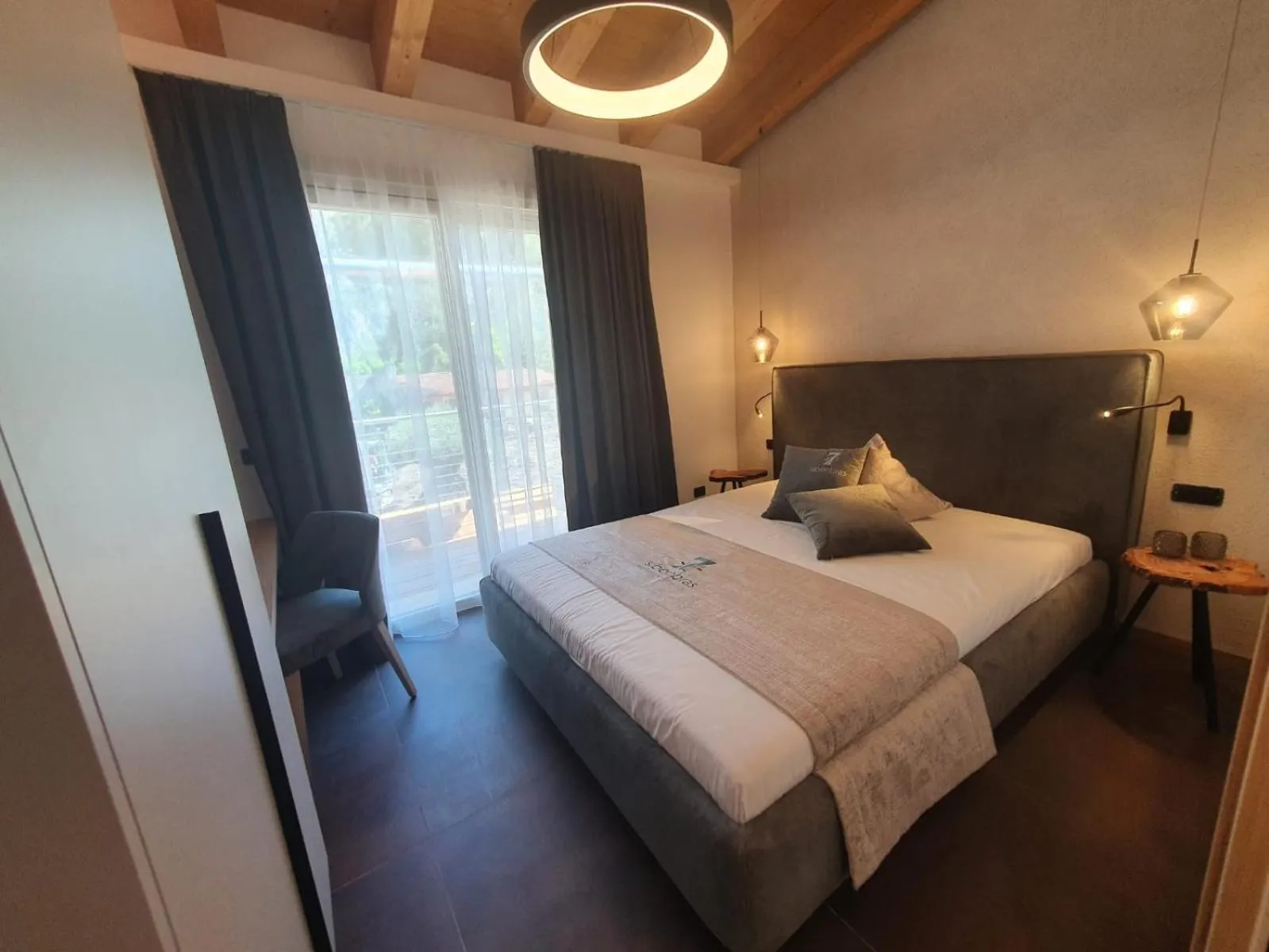 Bed in Sibenbras Natural Aparthotel