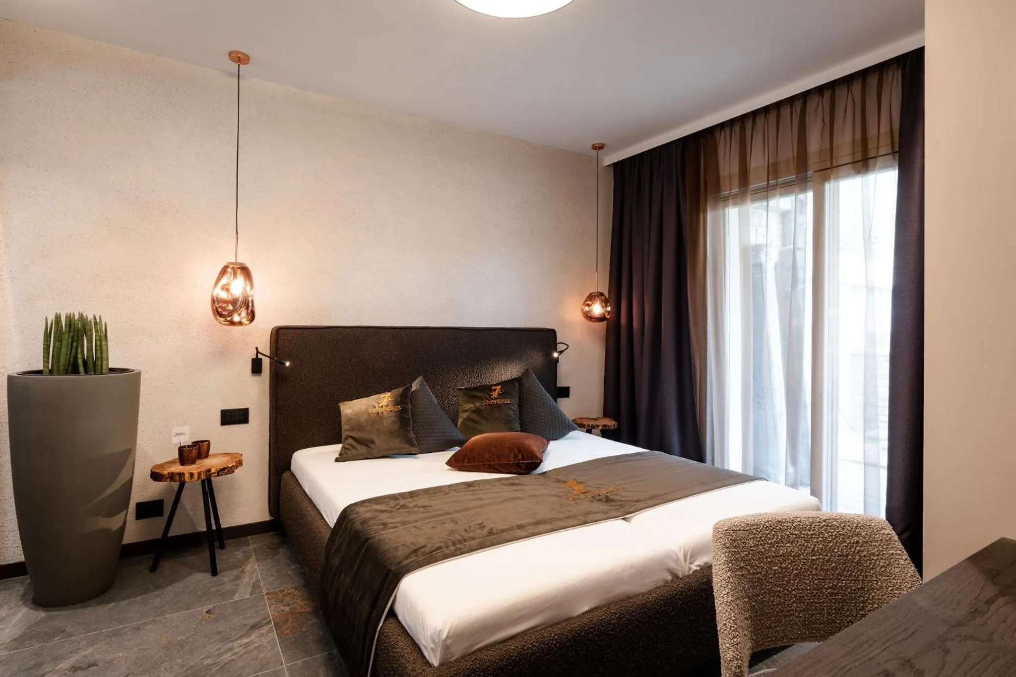 Bed in Sibenbras Natural Aparthotel