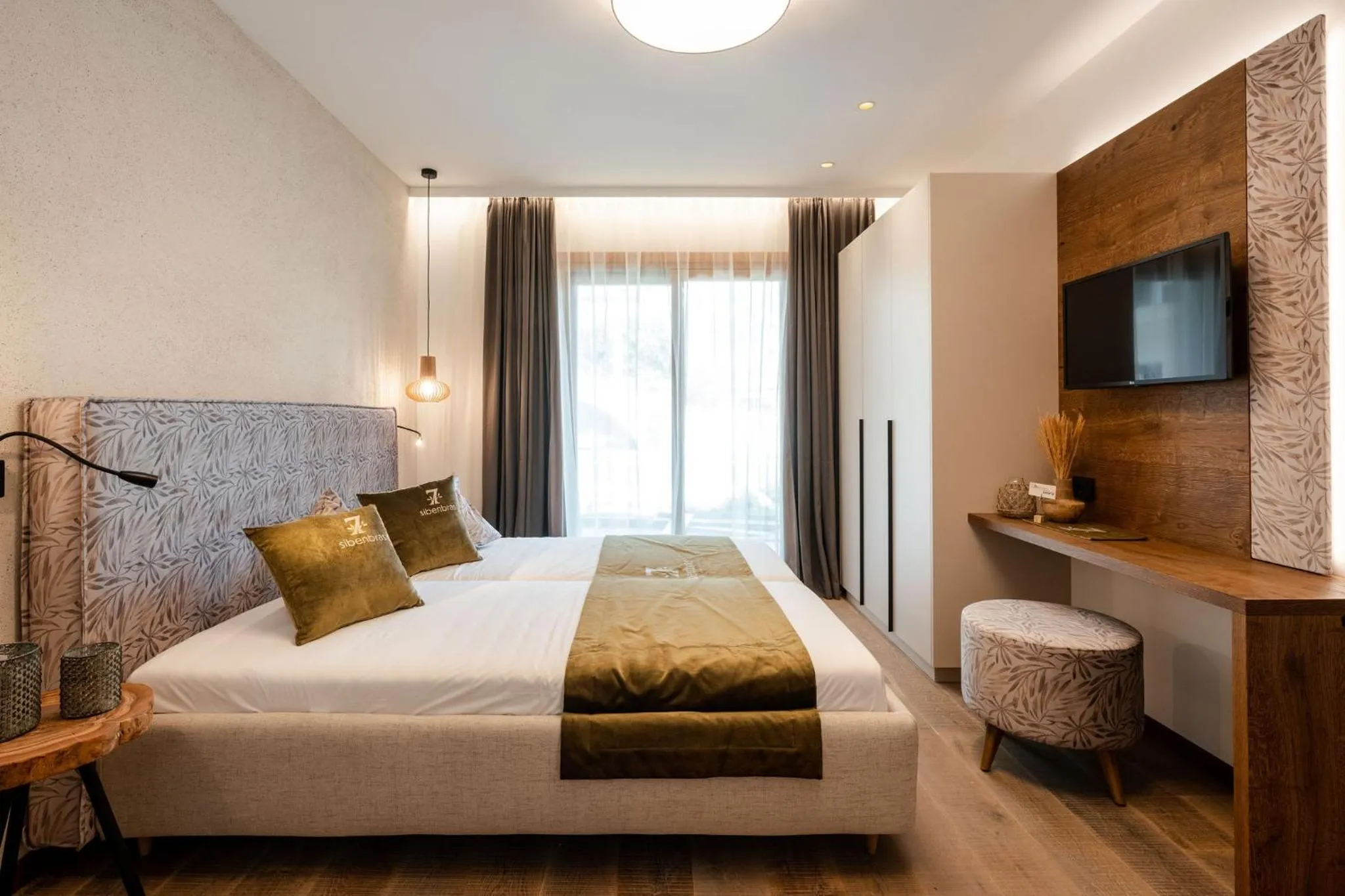 Bed in Sibenbras Natural Aparthotel