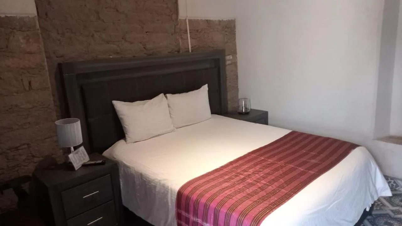 Bed in GRAN ALCÁZAR HOTEL BOUTIQUE
