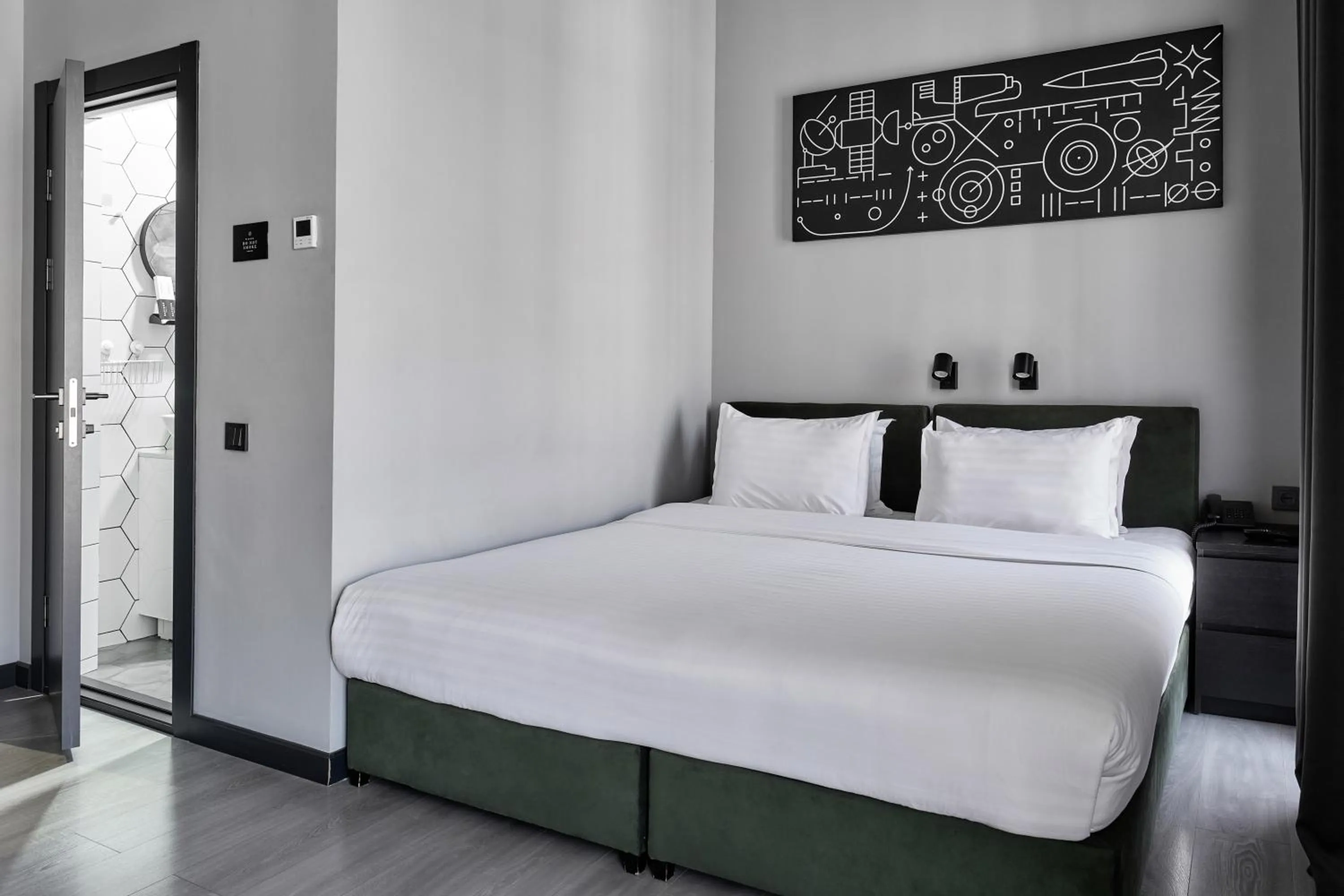 Bed in Sapiens Hotel