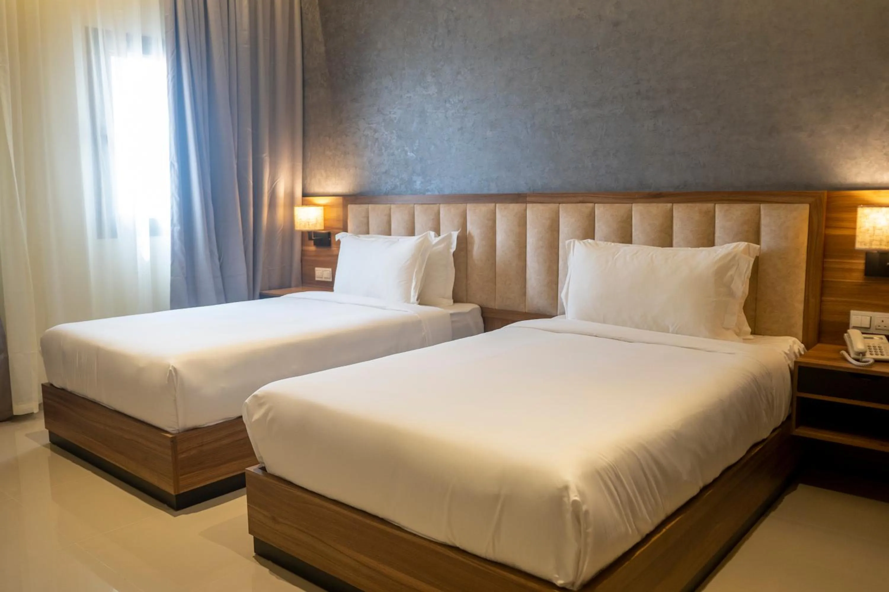 Bed in The Plaza Hotel & Resort