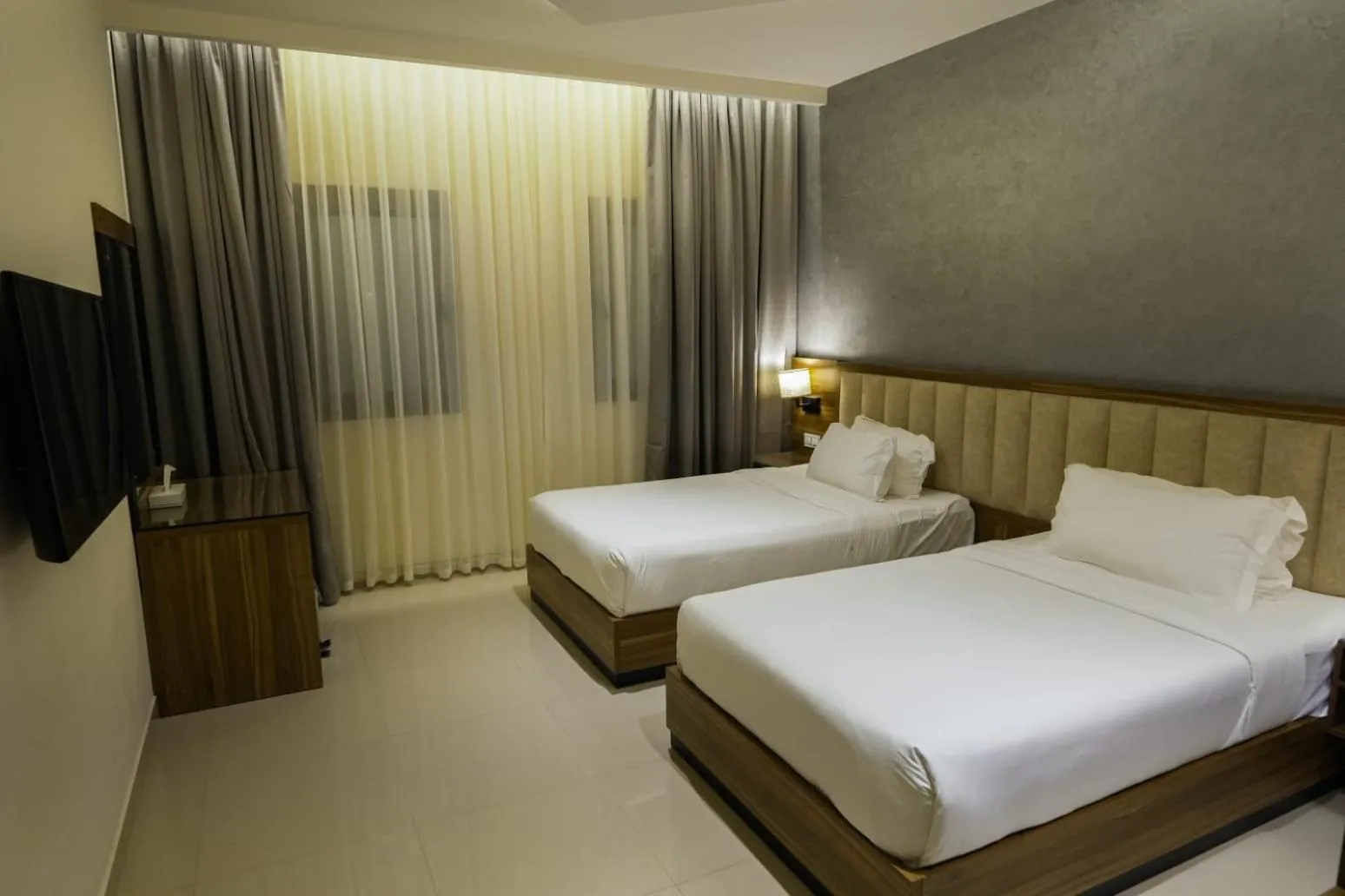 Bed in The Plaza Hotel & Resort