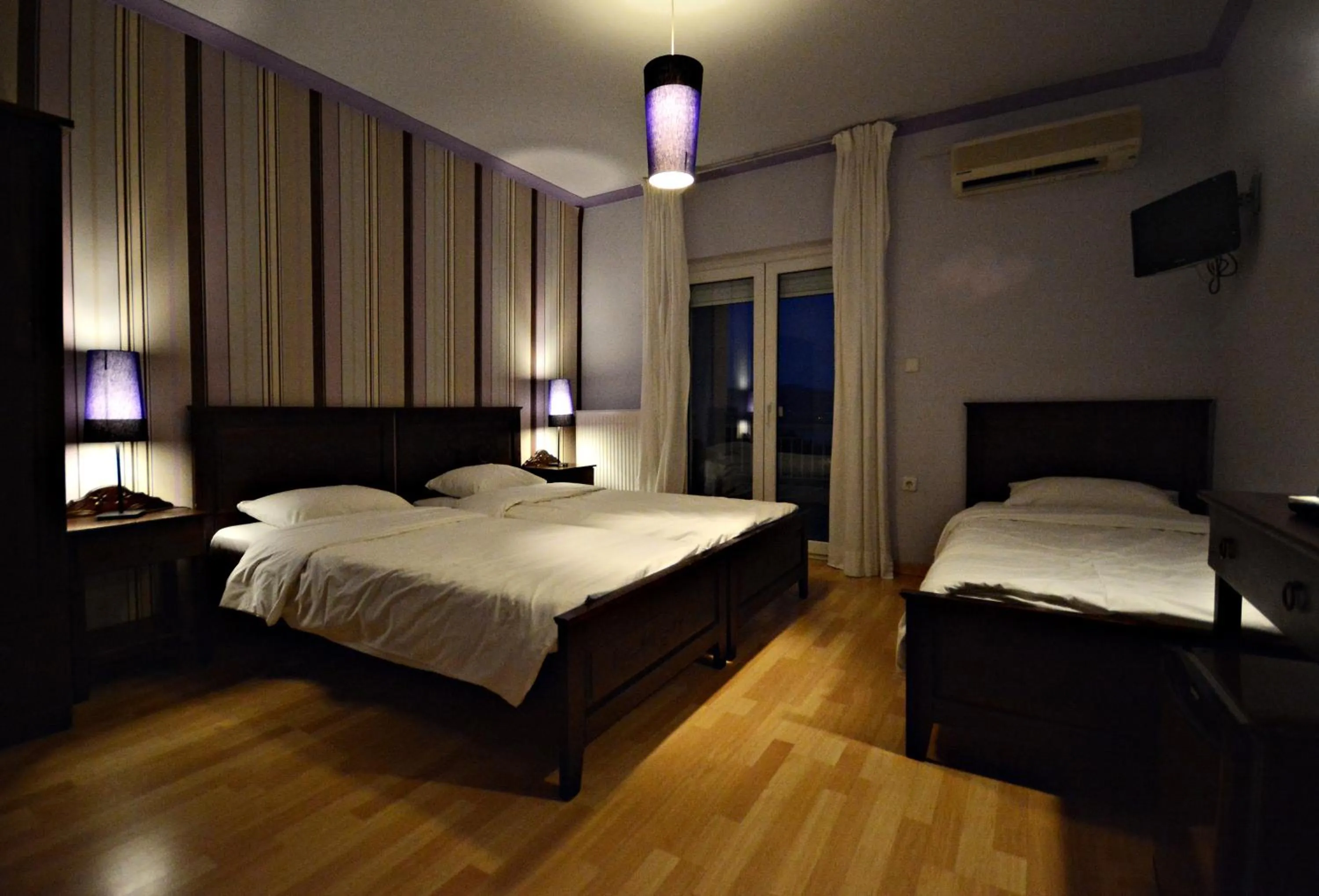 Photo of the whole room, Bed in Guesthouse Vissinokipos - Biker Friendly - Motorradhotel