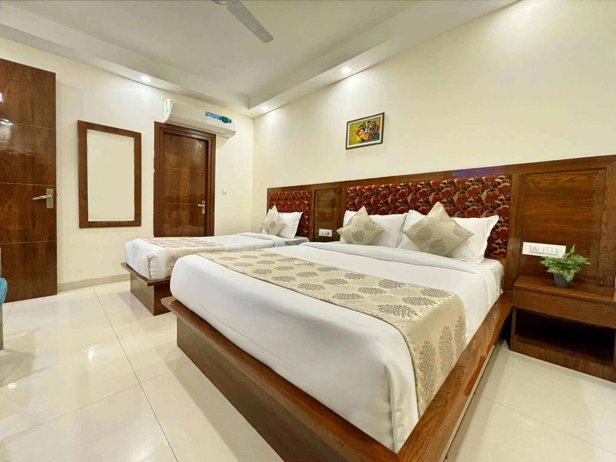 Bed in Hotel Emblem Suites- Near Delhi Airport