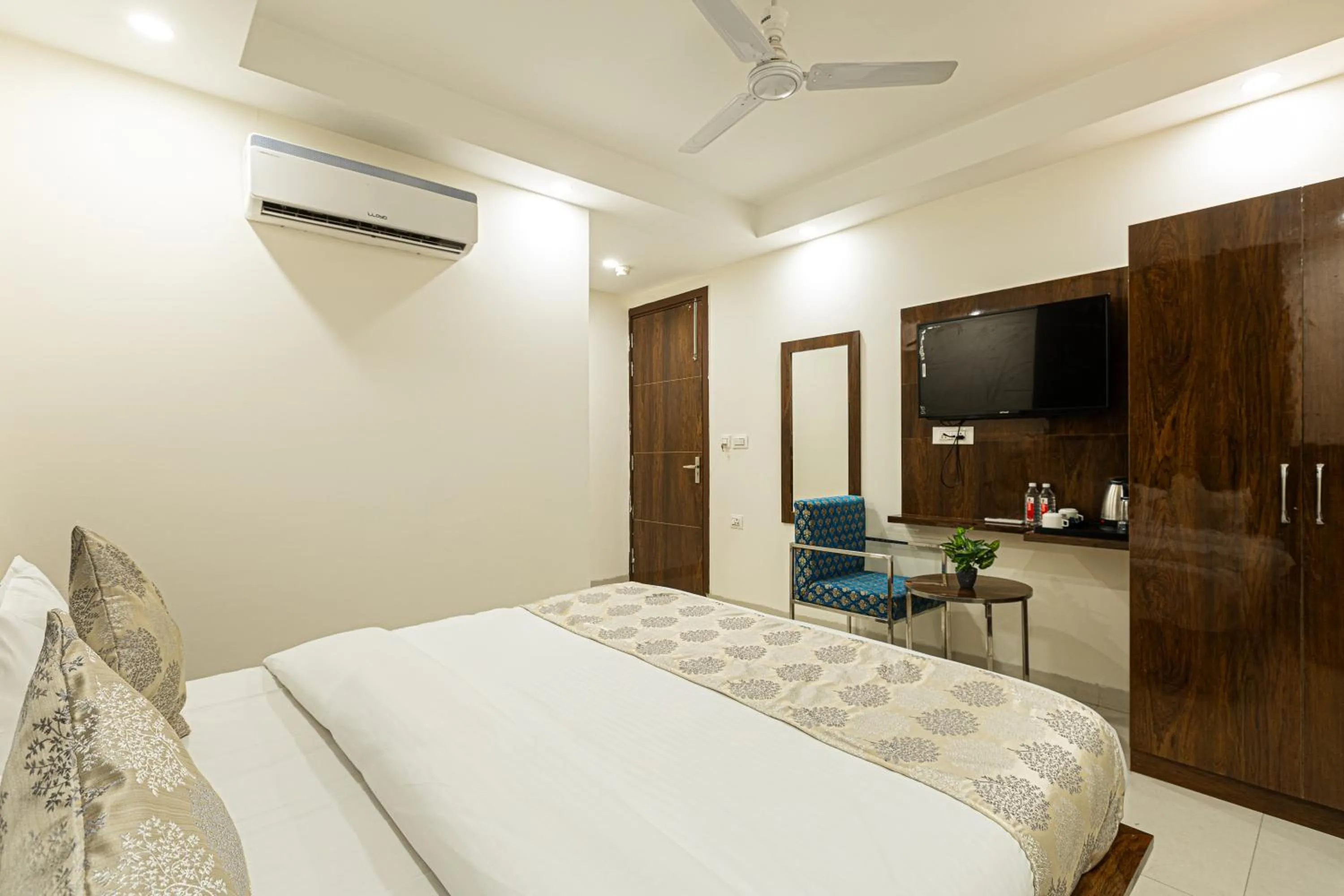 Bed in Hotel Emblem Suites- Near Delhi Airport
