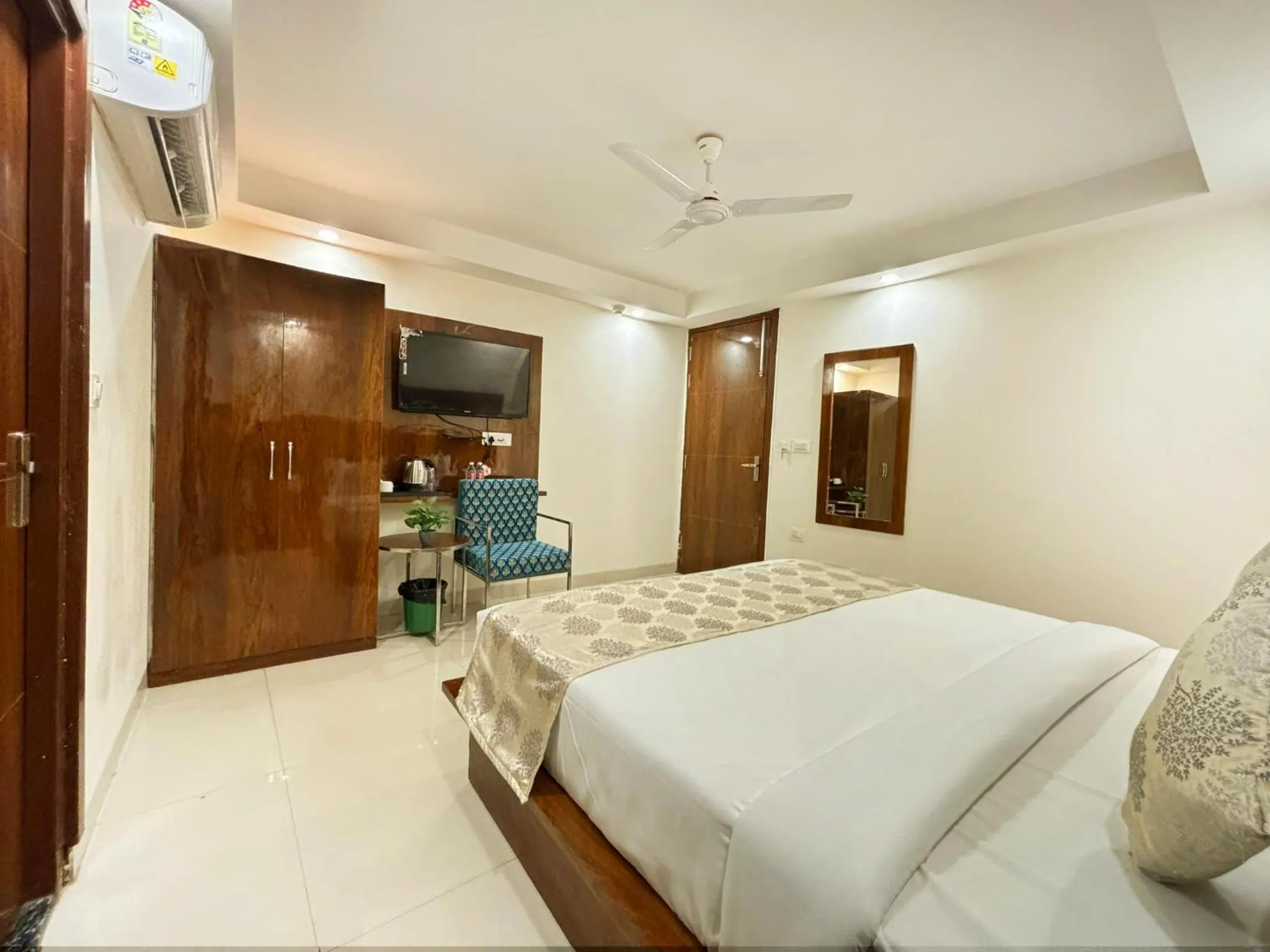 Bed in Hotel Emblem Suites- Near Delhi Airport