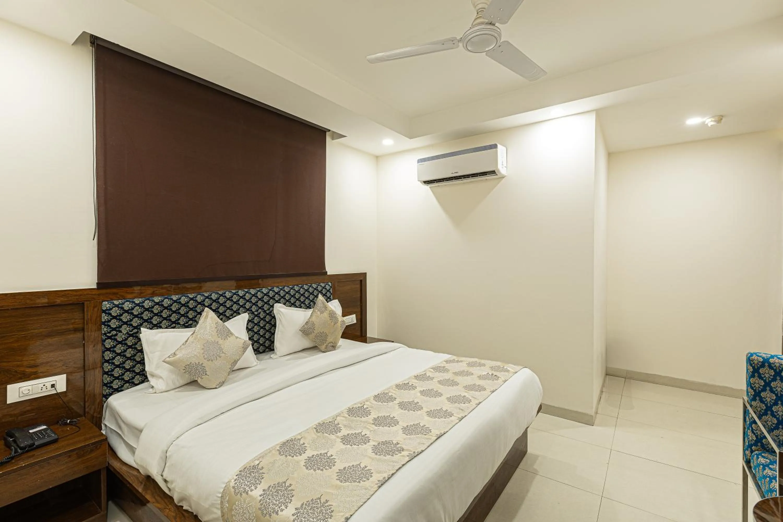 Bed in Hotel Emblem Suites- Near Delhi Airport