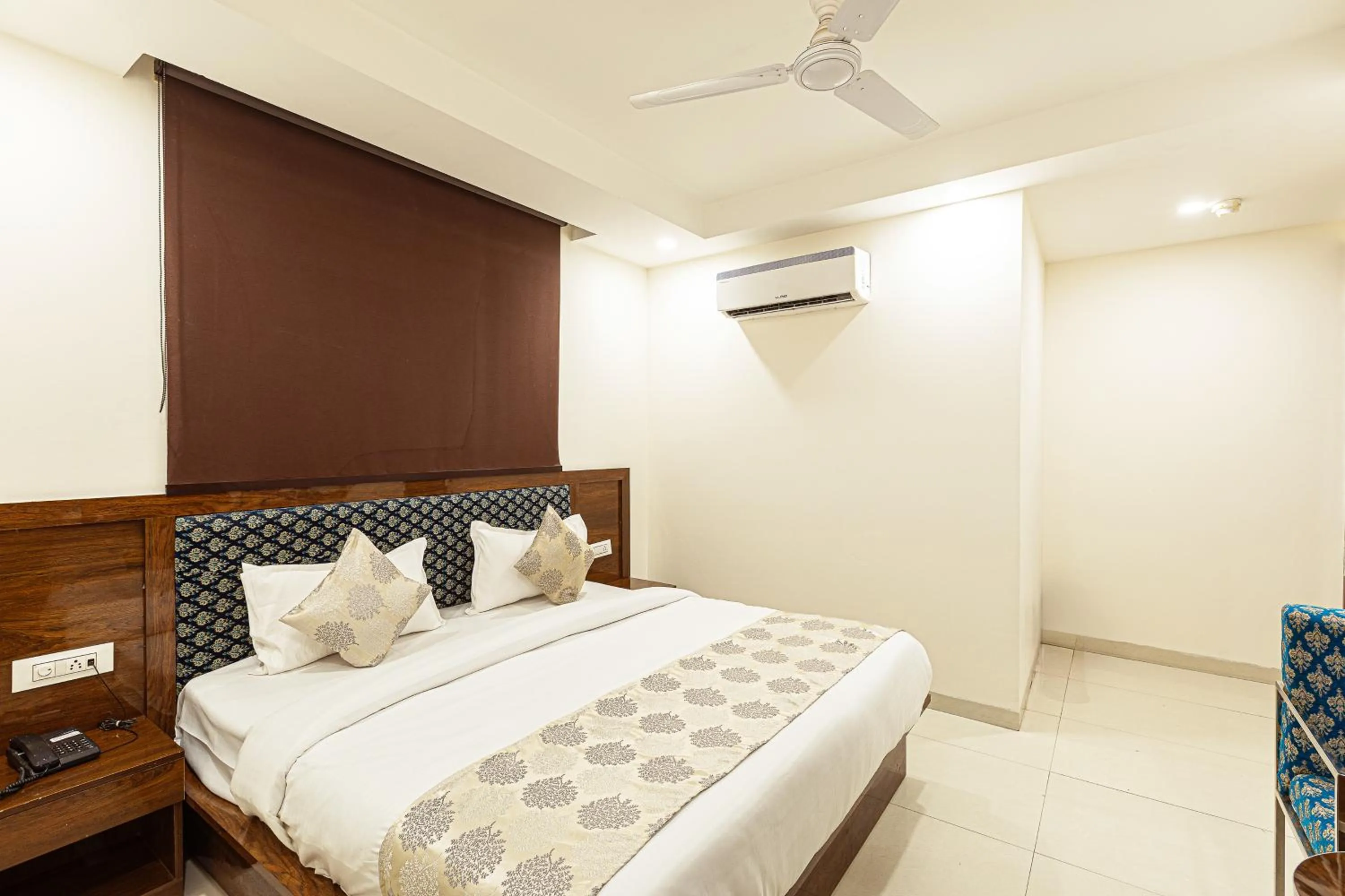Bed in Hotel Emblem Suites- Near Delhi Airport