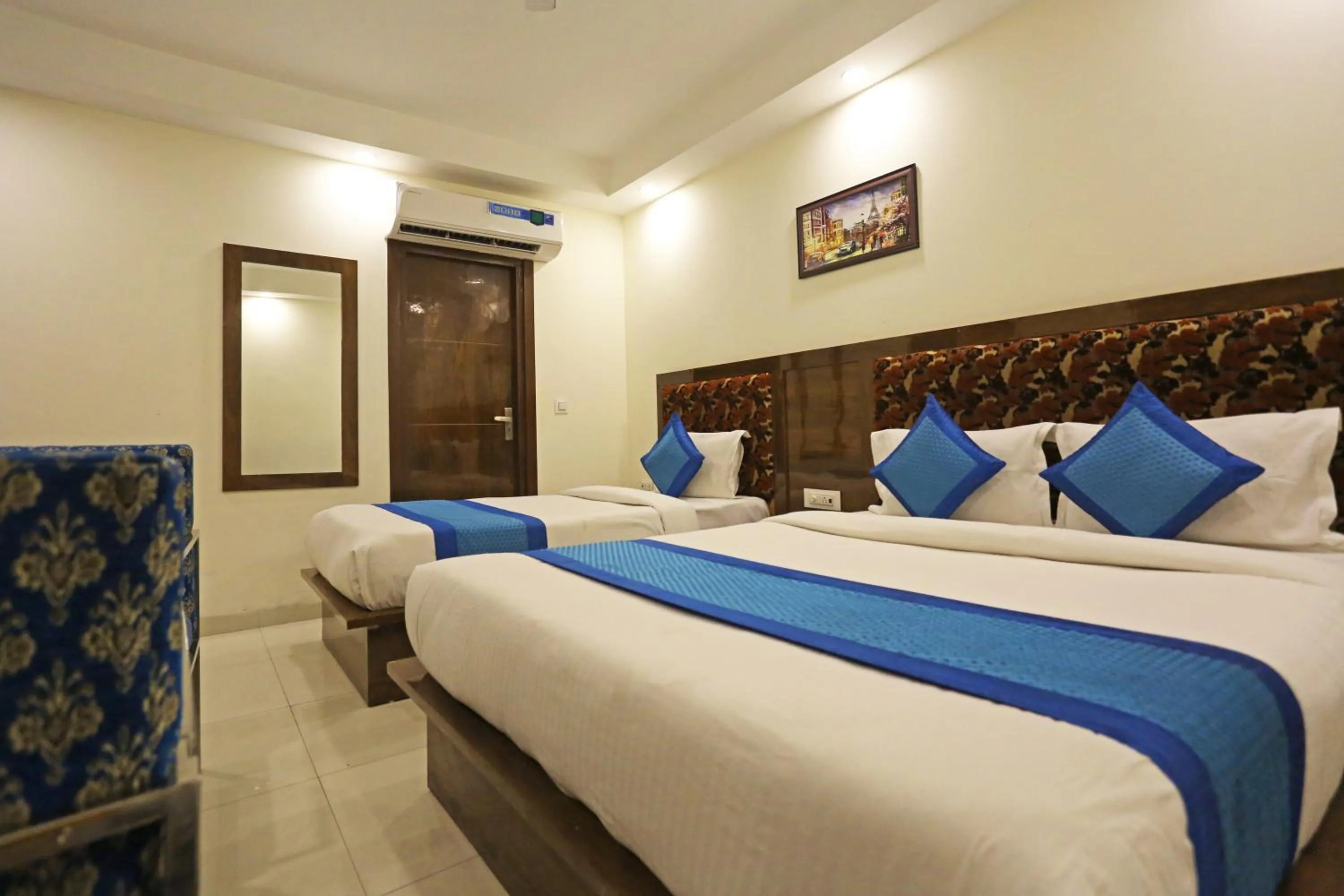 Bed in Hotel Emblem Suites- Near Delhi Airport