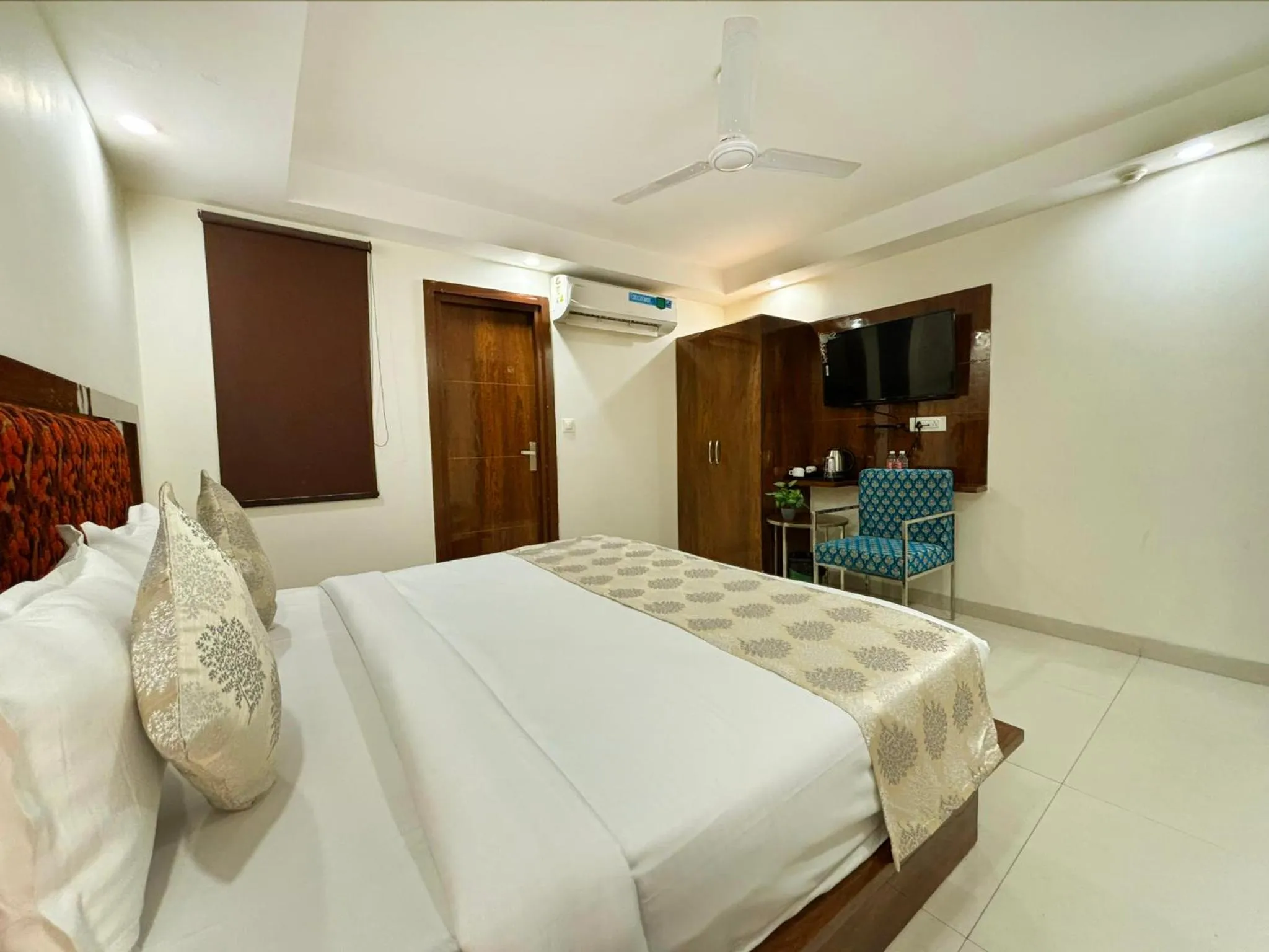 Bed in Hotel Emblem Suites- Near Delhi Airport