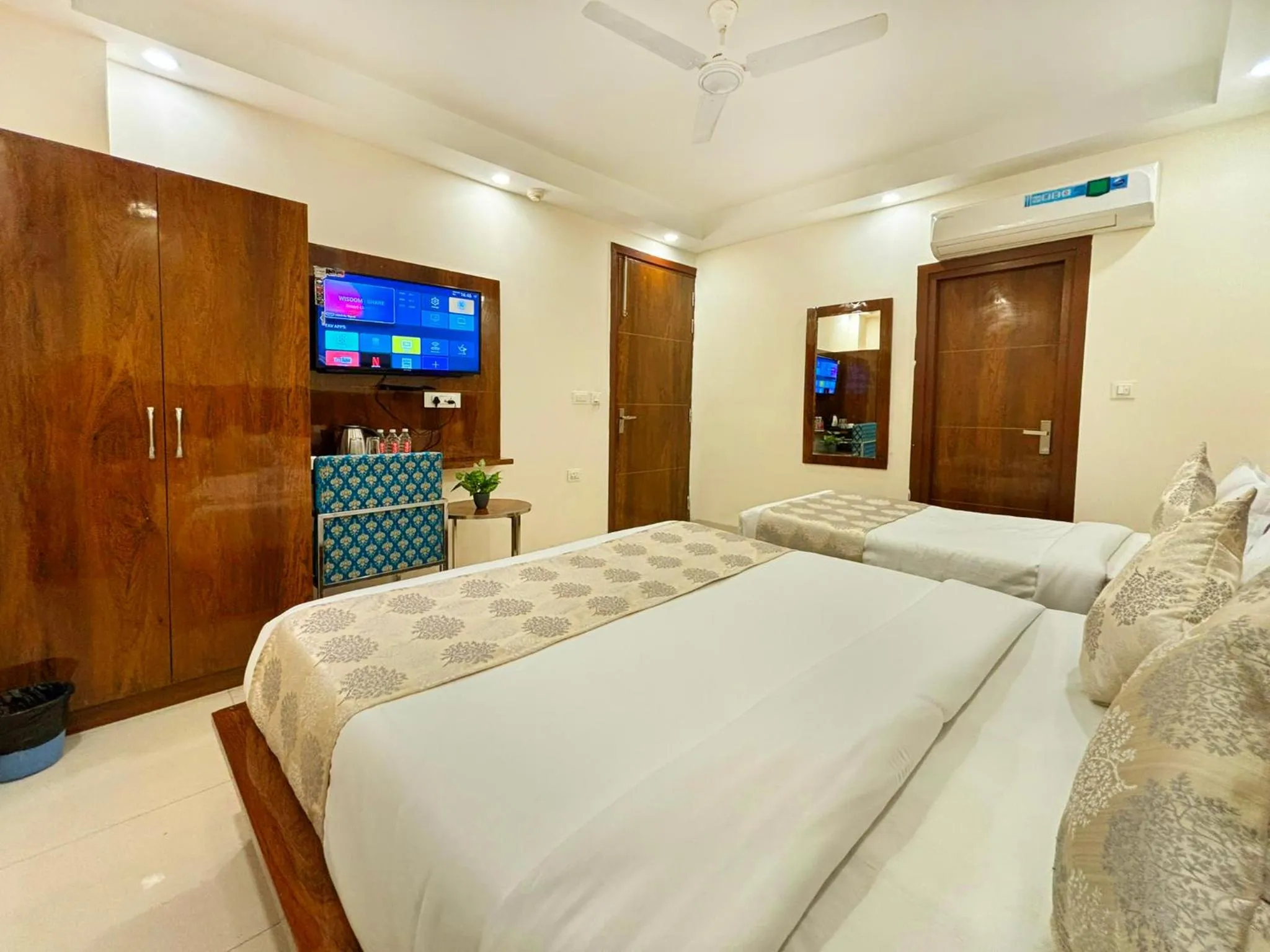 Bed in Hotel Emblem Suites- Near Delhi Airport