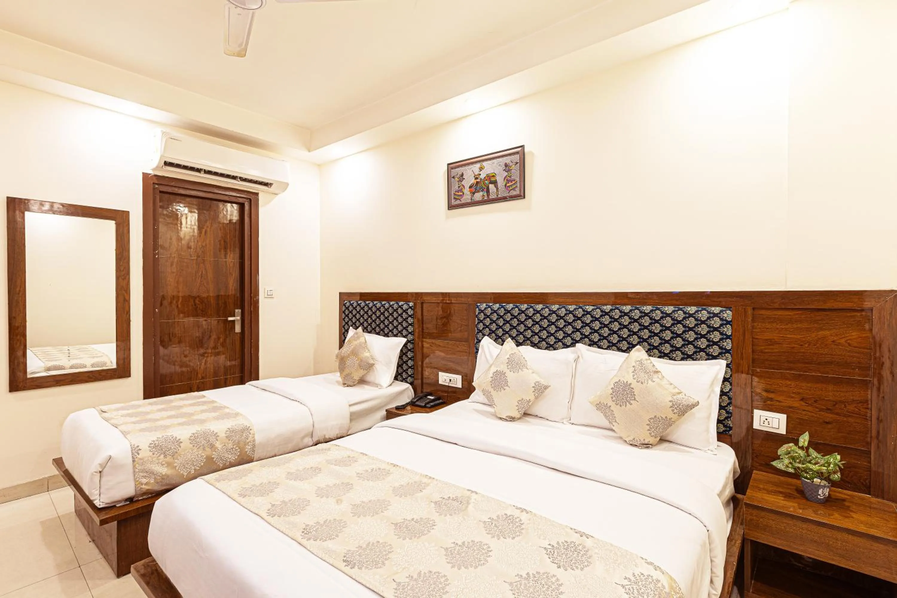 Bed in Hotel Emblem Suites- Near Delhi Airport