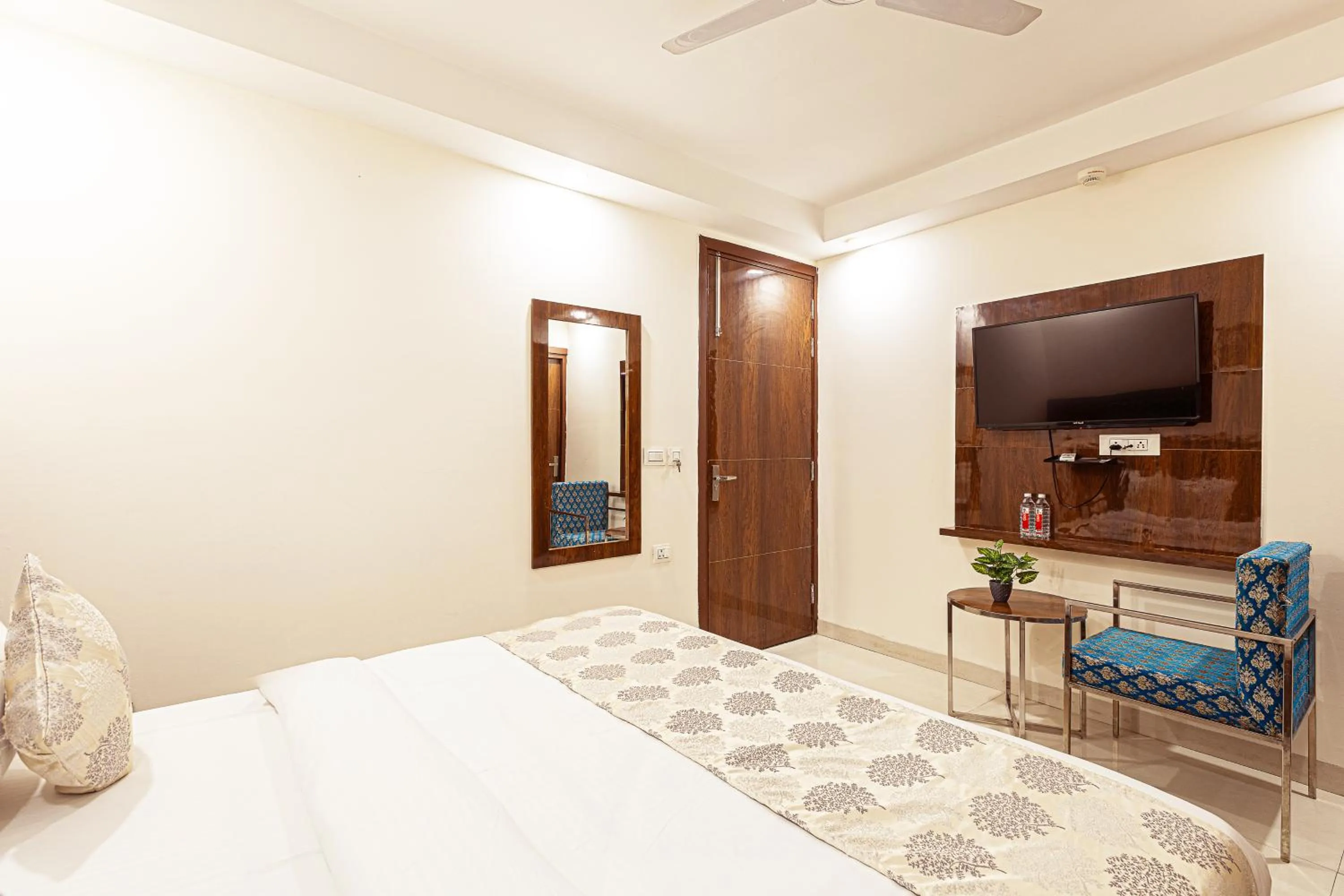 Bed in Hotel Emblem Suites- Near Delhi Airport