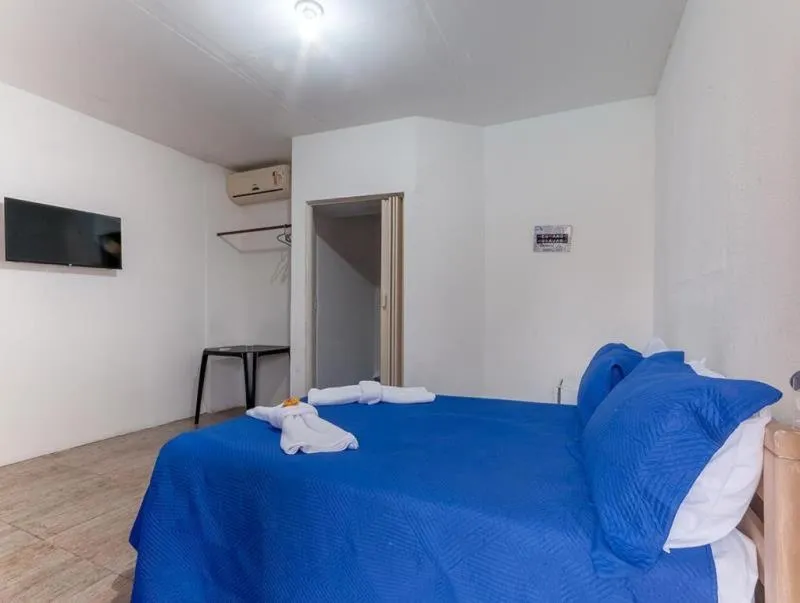 Bed in Pousada Ponta dos Corais