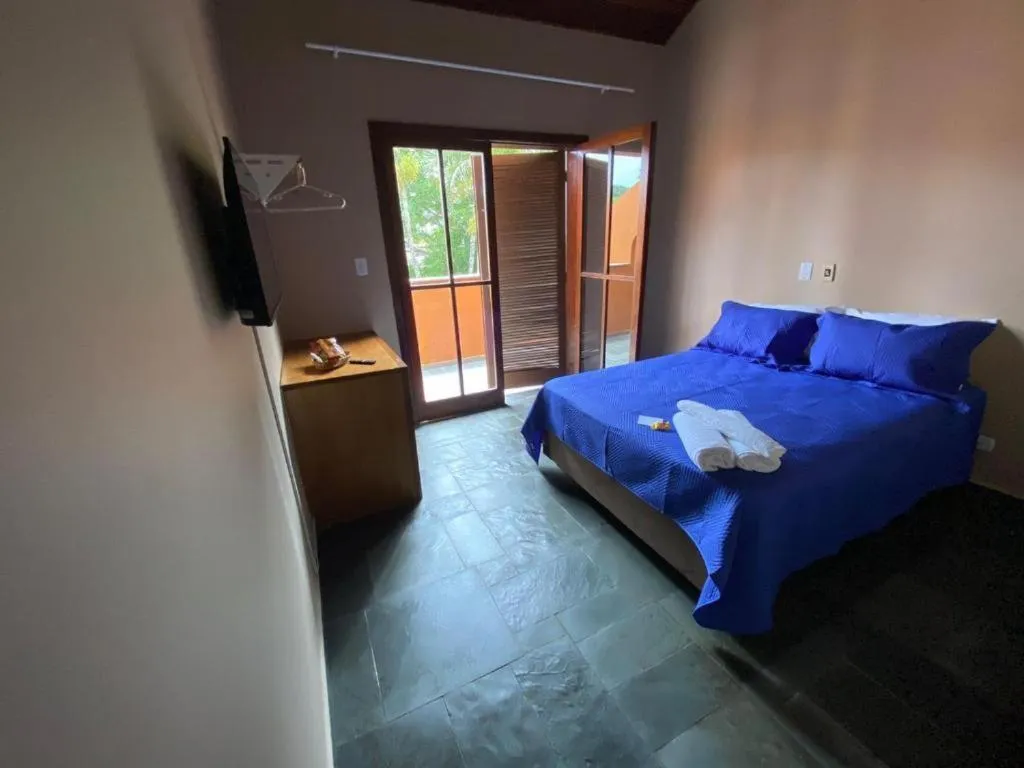 Bed in Pousada Ponta dos Corais