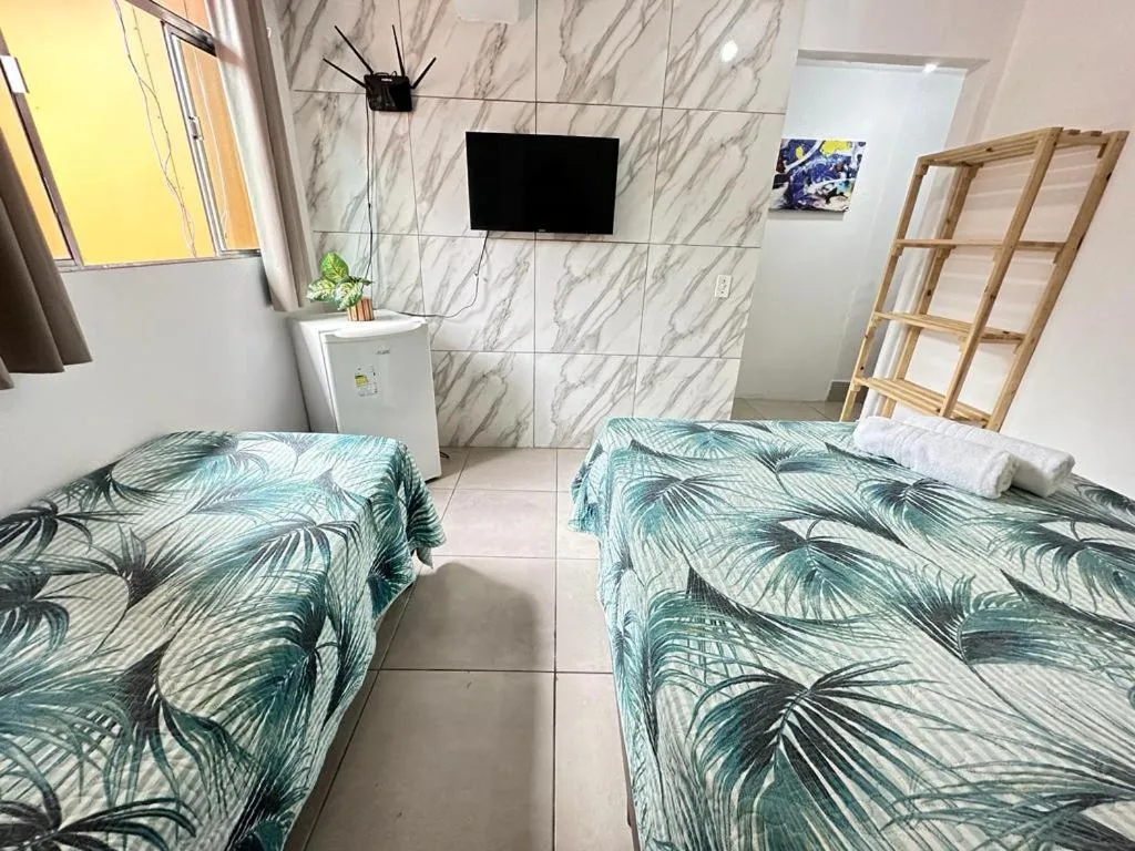 Bed in Pousada Ponta dos Corais